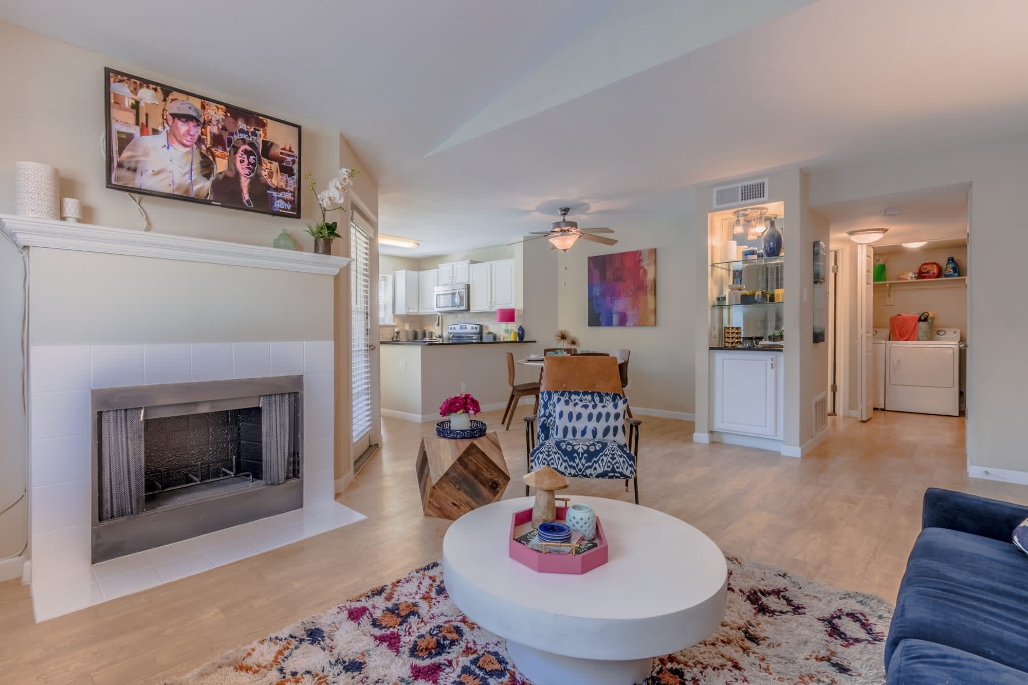 Living room with fireplace mantel at Canterbury Courts in Richardson, Texas