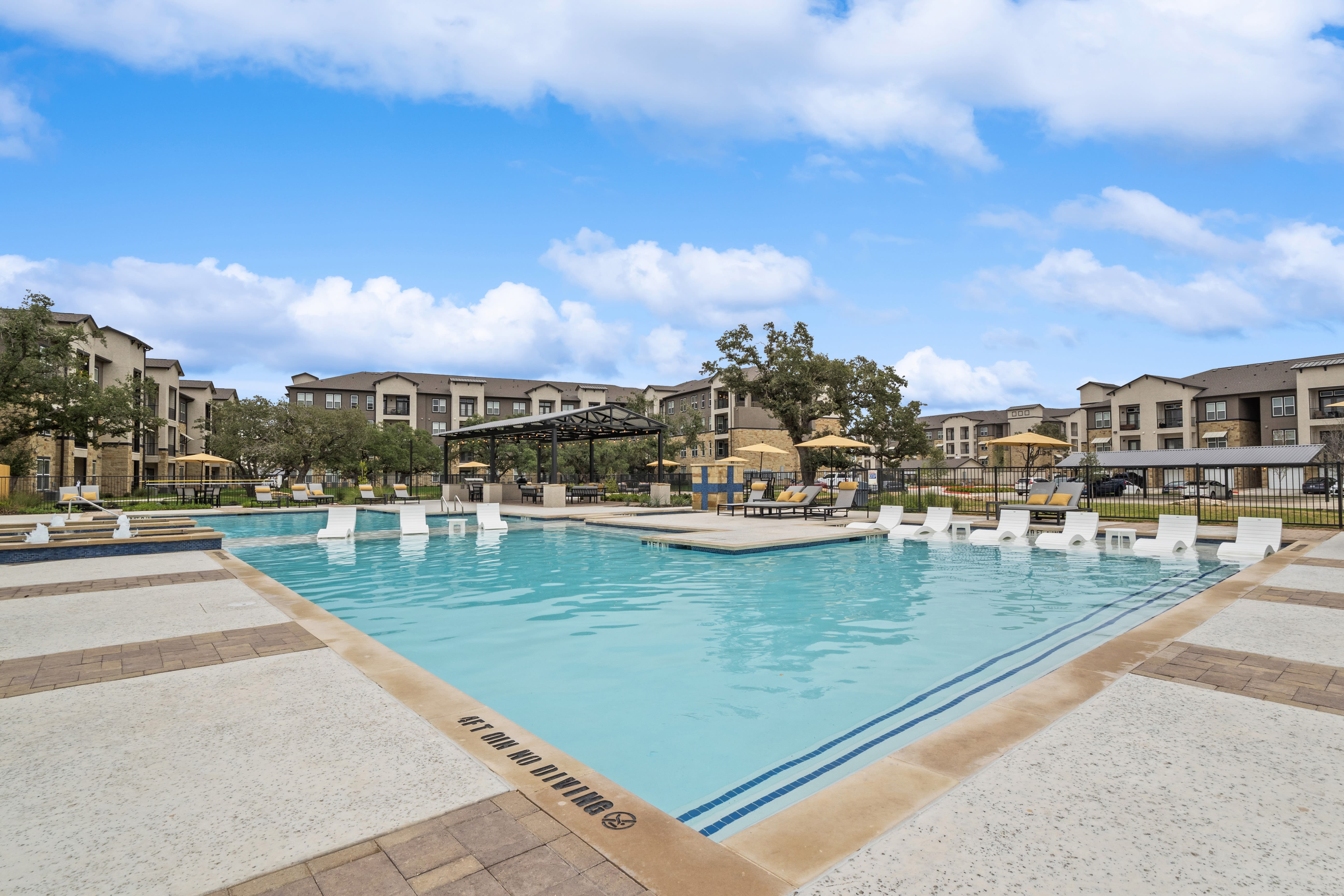 The resort-style swimming pool at Radius Wolf Ranch in Georgetown, Texas