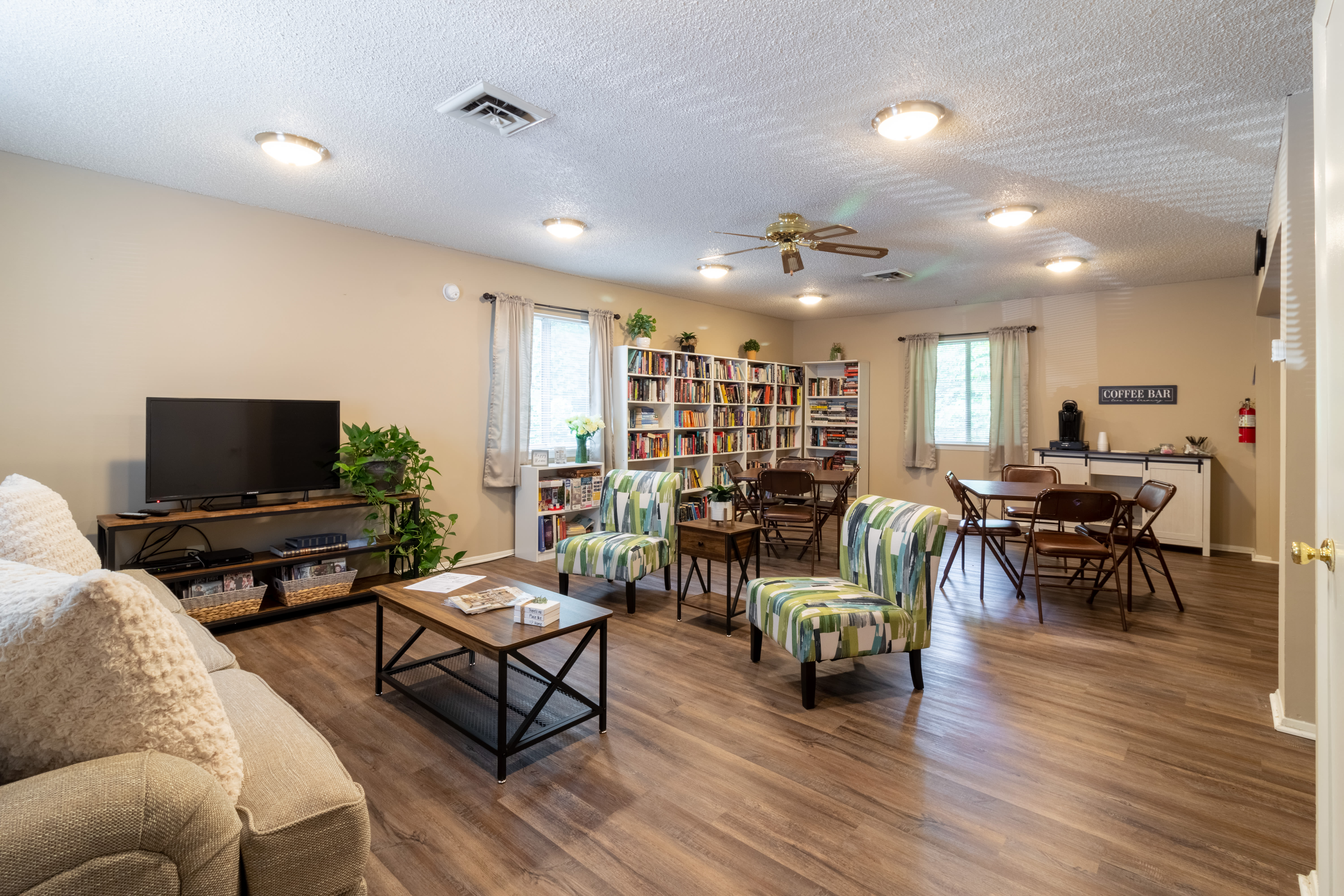 Club house with coffee bar and seating at Arbor Crest Apartments in Charlottesville, Virginia