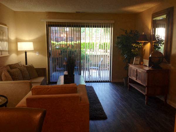 Living room with slider door to patio at Muirwood Gardens in Martinez, California