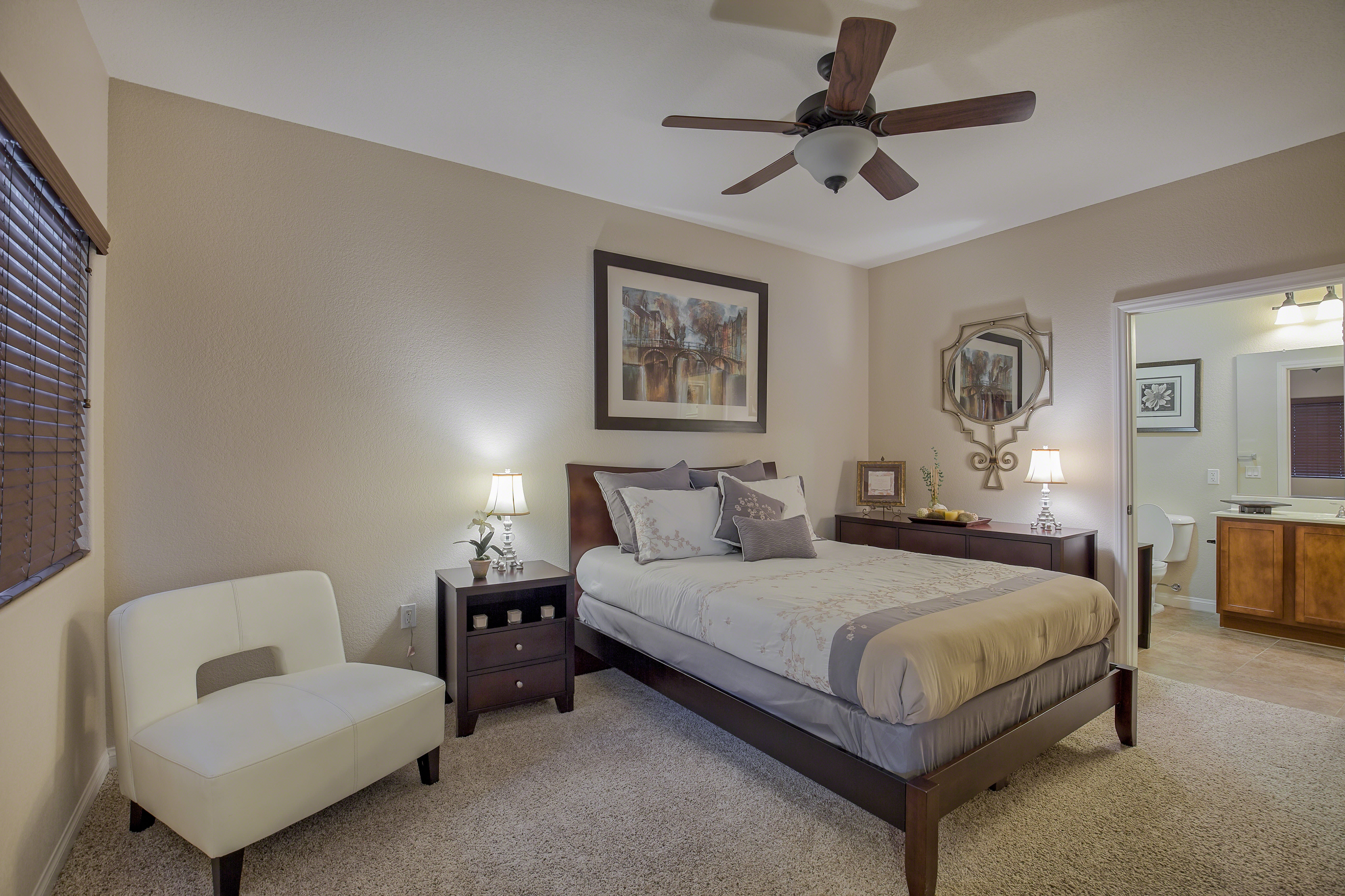 Bedroom with ceiling fan at  Miraflores Apartments in El Centro, California
