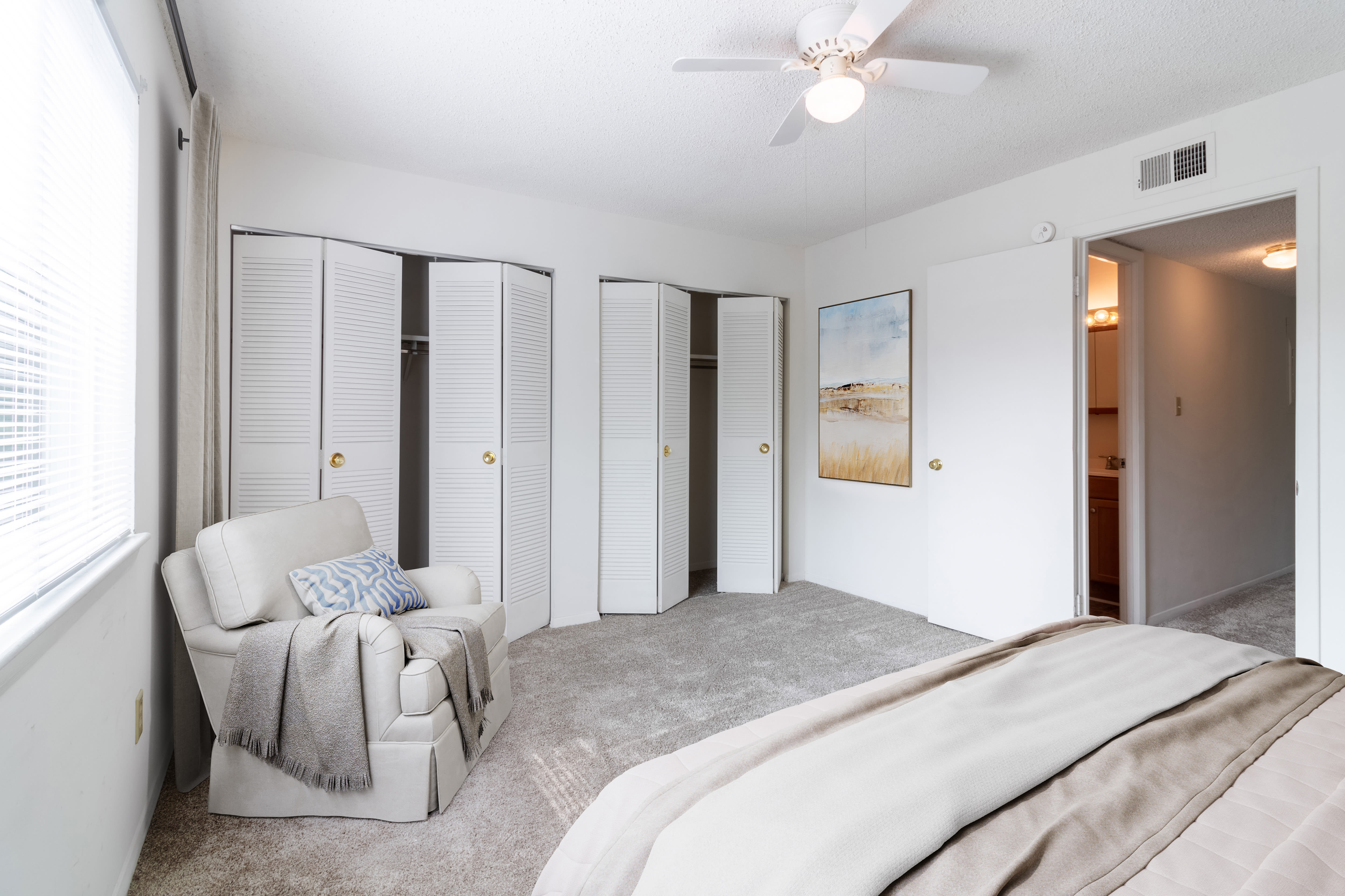 Bedroom with closet and a couch Arbor Crest Apartments in Charlottesville, Virginia