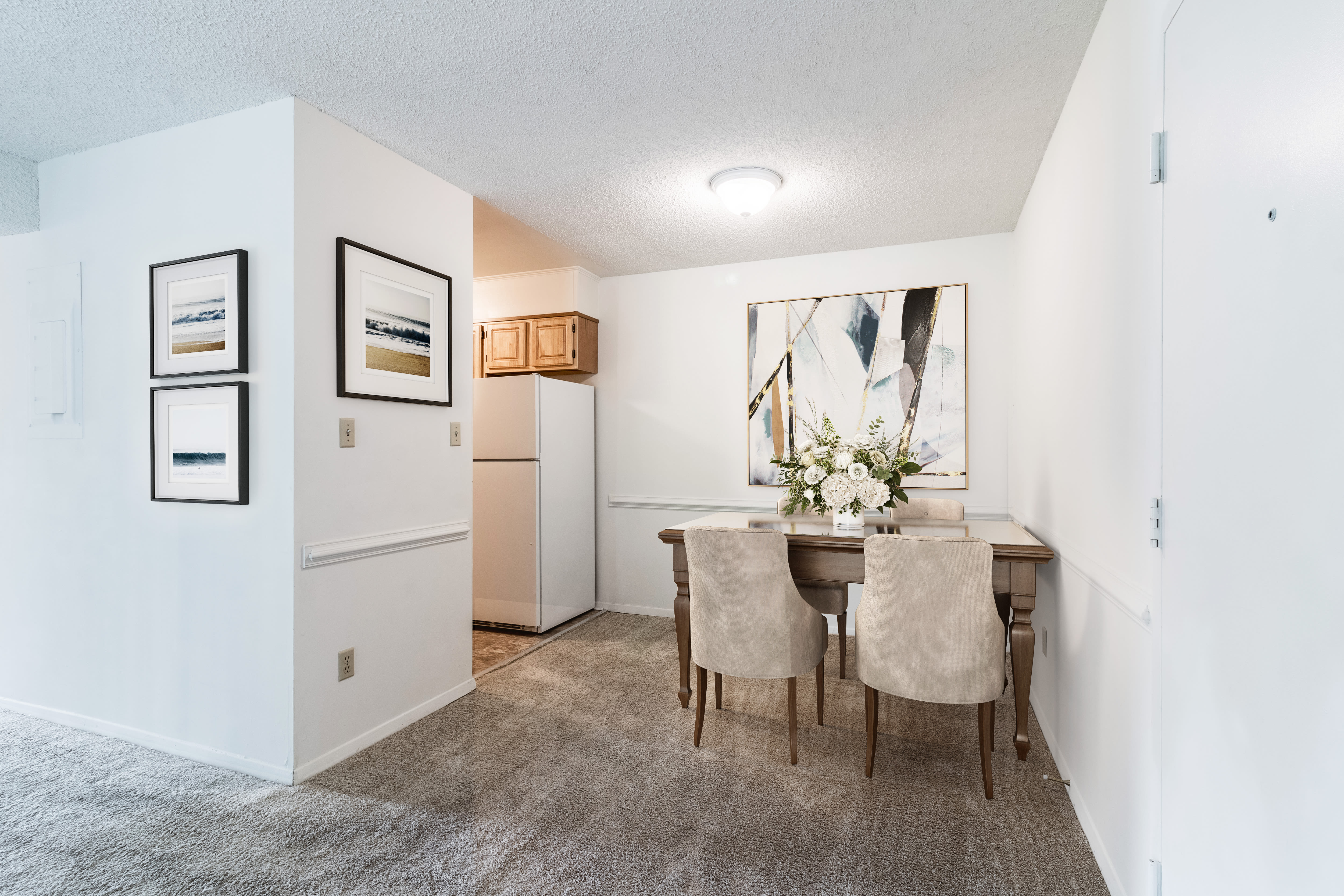 Dining room with close access to fully-equipped kitchen and living room at Arbor Crest Apartments in Charlottesville, Virginia