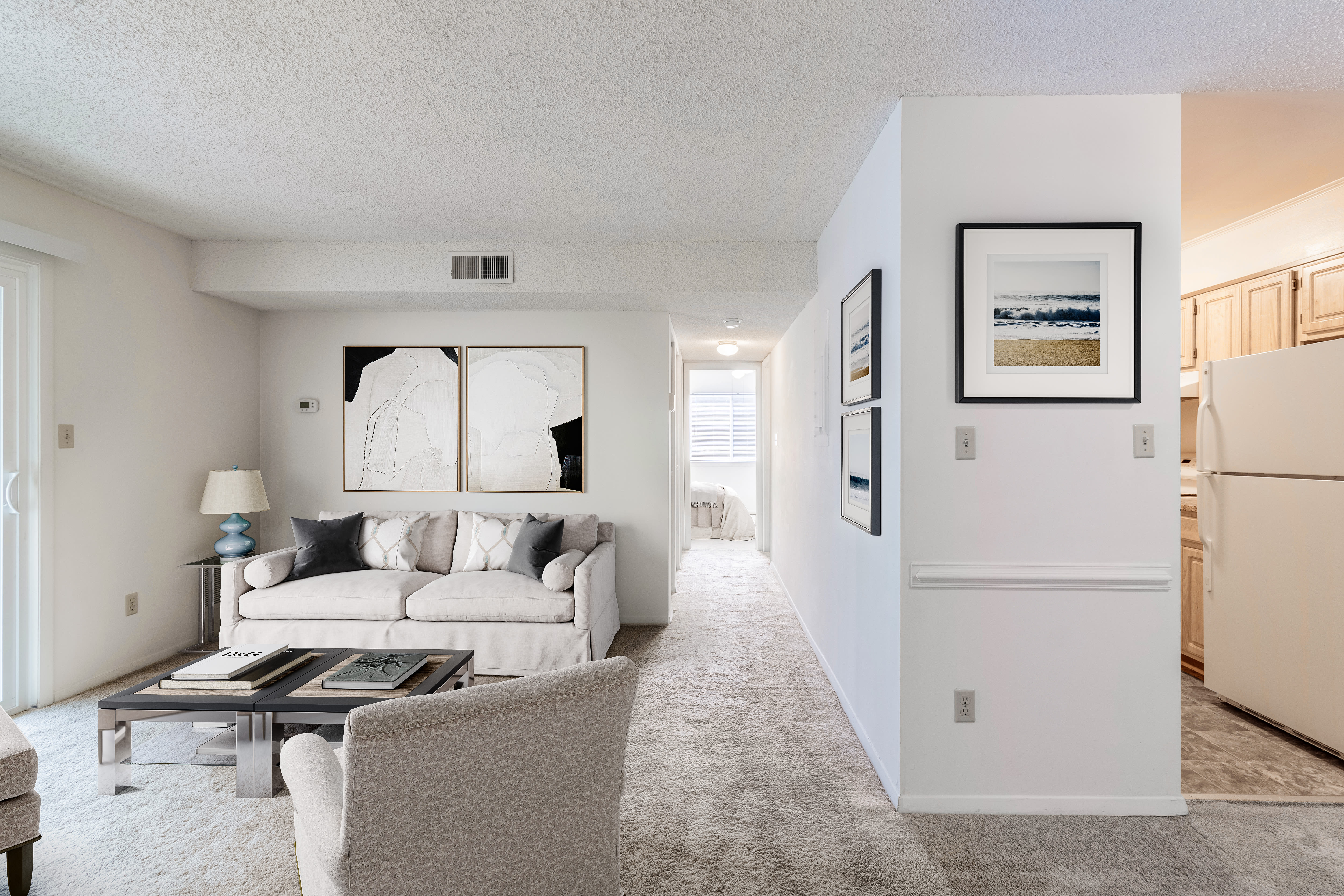 Living room with close access to bedroom and kitchen at Arbor Crest Apartments in Charlottesville, Virginia