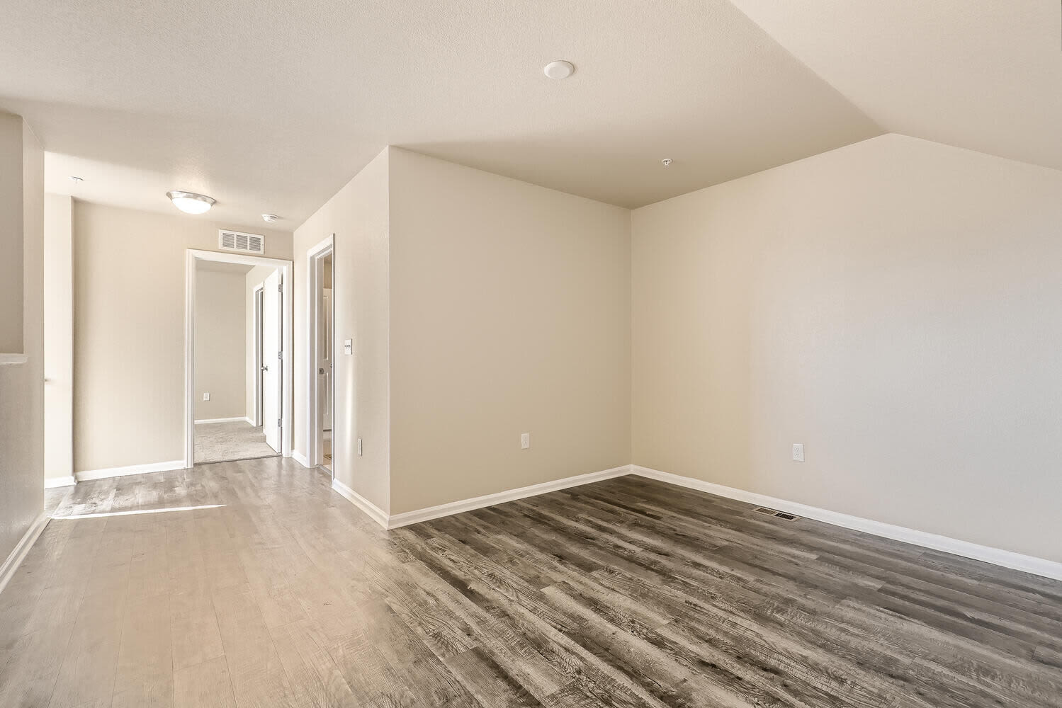Wood-style flooring in an apartment living room at Maple Leaf Townhomes in Arvada, Colorado