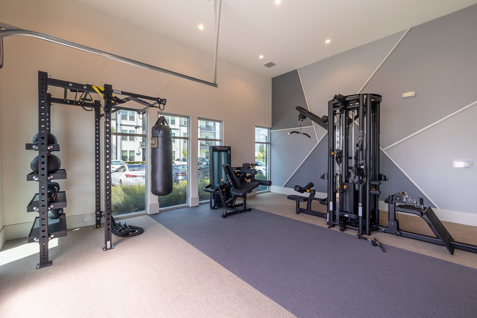 Well-equipped fitness center at Indigo Champions Ridge in Davenport, Florida