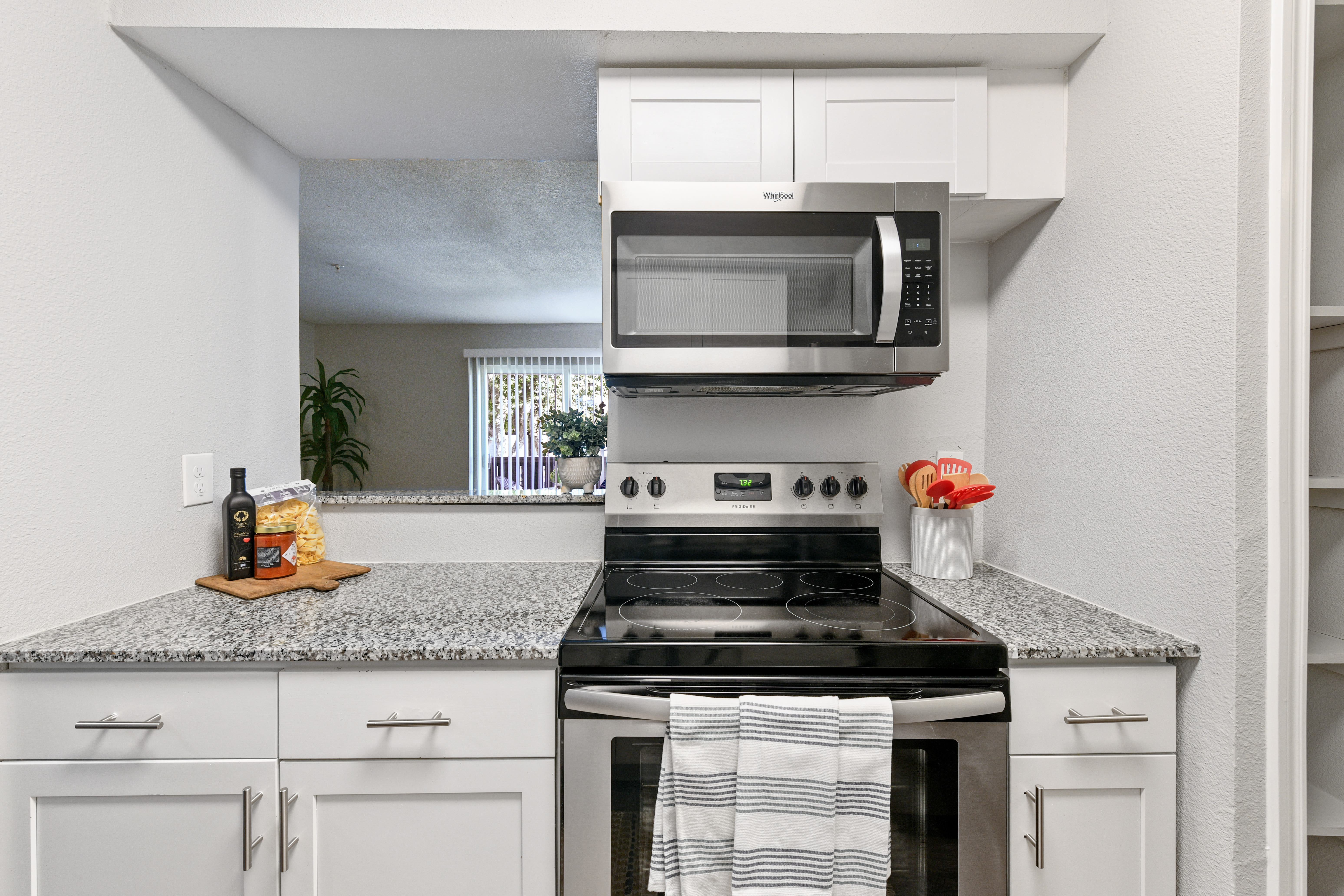 Kitchen with microwave at The Broadway in Garland, Texas