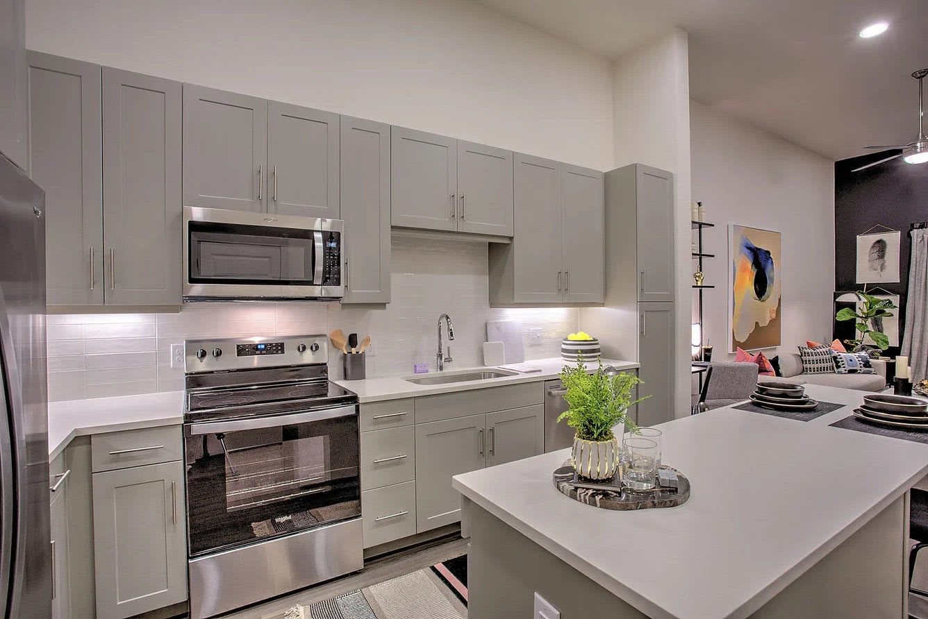 Kitchen with stainless-steel appliances at Ross + Peak in Dallas, Texas