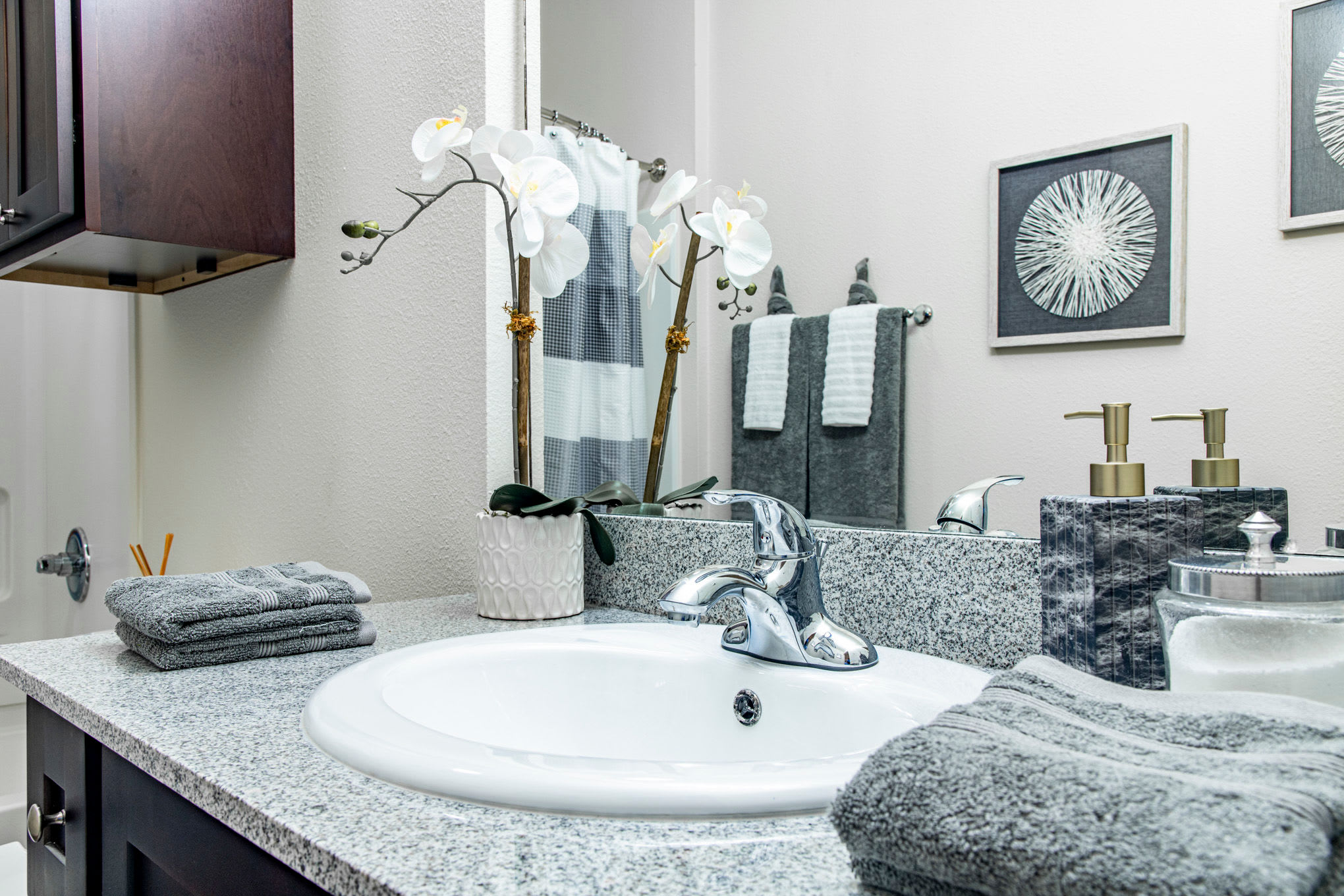 Granite countertops in an apartment bathroom at The Highland Club in Baton Rouge, Louisiana