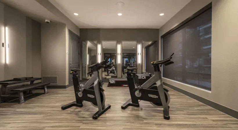 Bikes in the fitness center at The Register in Richardson, Texas