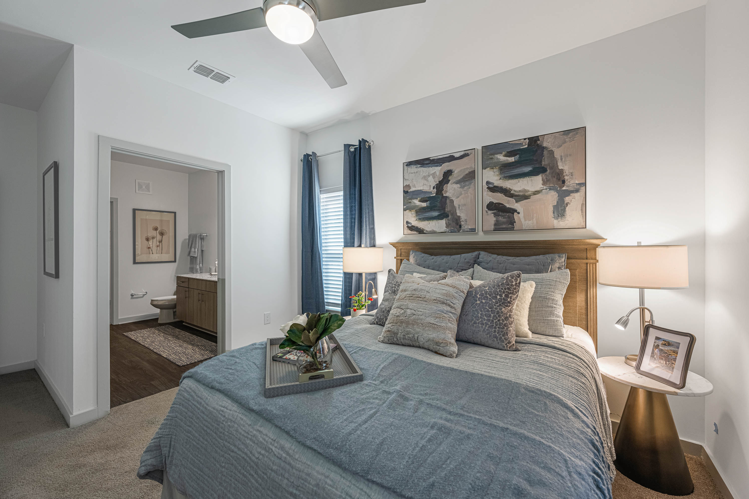 Bright bedroom with ceiling fan at The Massell in Cartersville, Georgia
