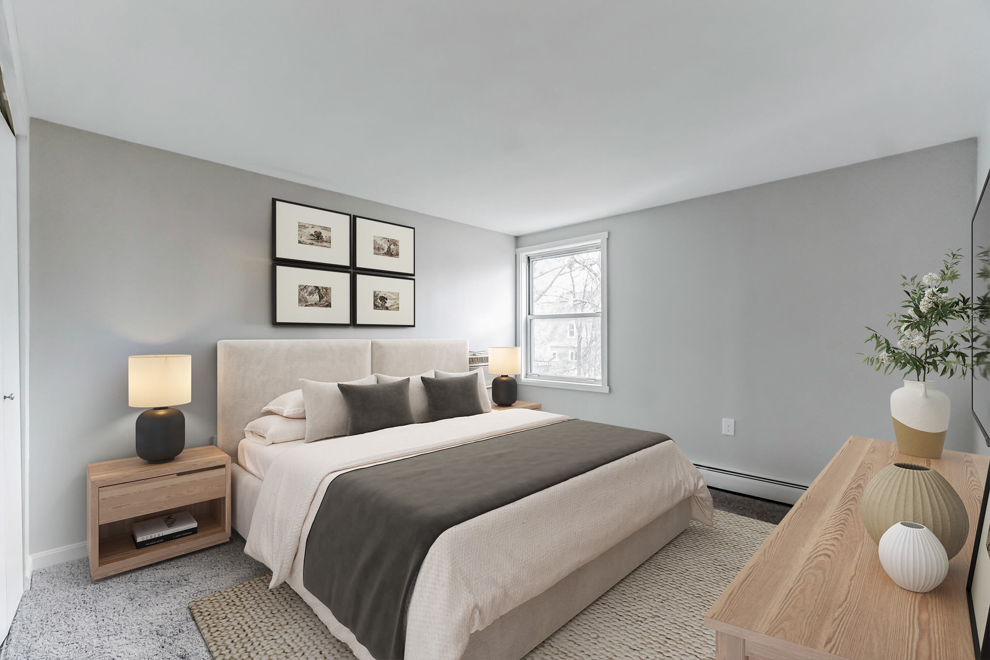 Modern Bedroom with White Bed at  Eagle Rock Apartments & Townhomes at Brighton in Brighton, Massachusetts
