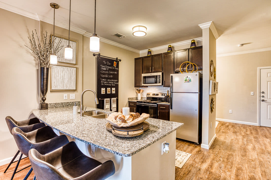 Modern kitchen and island at Carroll at Rivery Ranch in Georgetown, Texas
