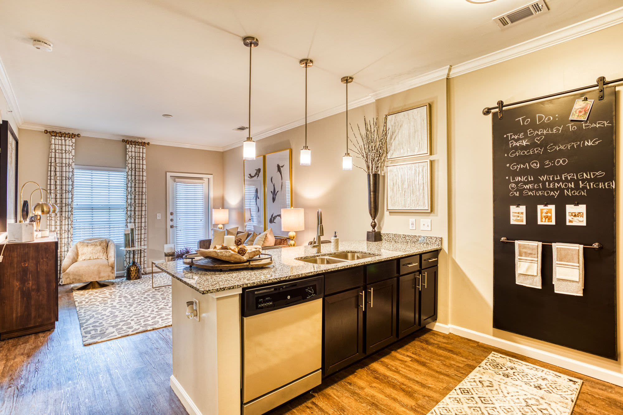 Kitchen and living room area at Carroll at Rivery Ranch in Georgetown, Texas