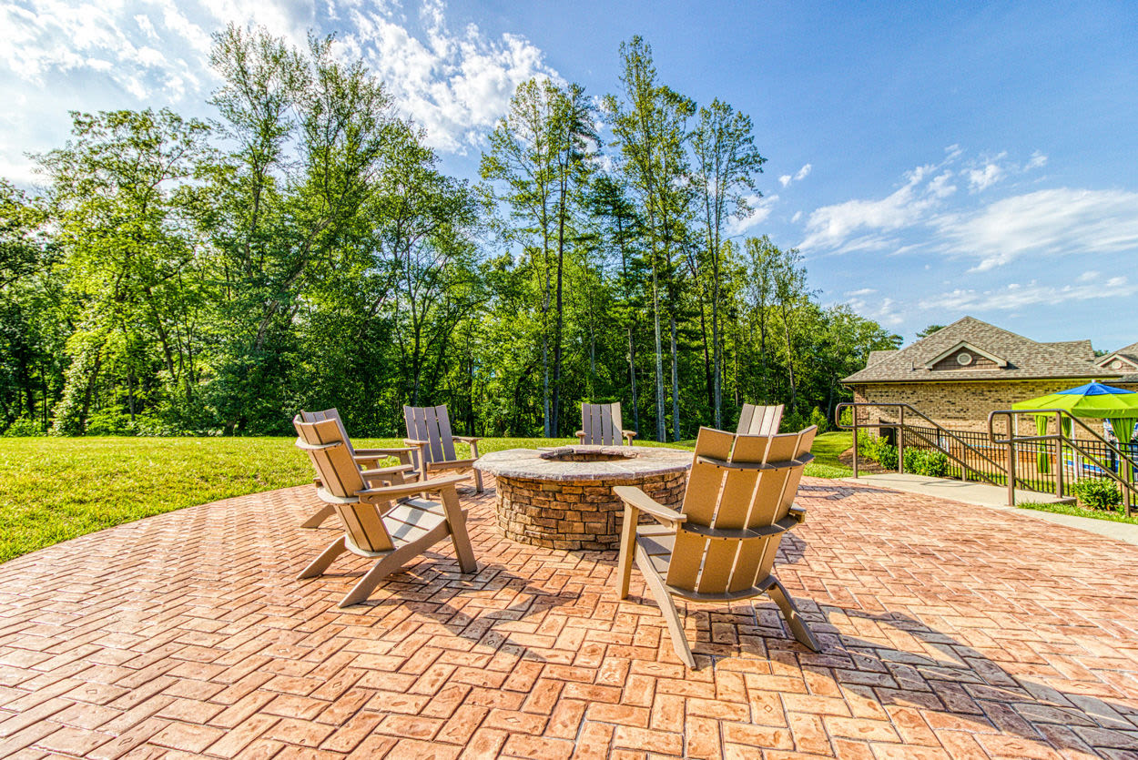 Fire pit with surrounding chairs at Greymont Village in Asheville, North Carolina