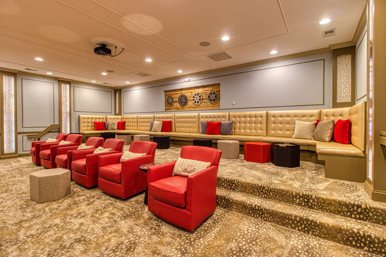 Community movie theater with comfortable theater-style seats at Greymont Village in Asheville, North Carolina