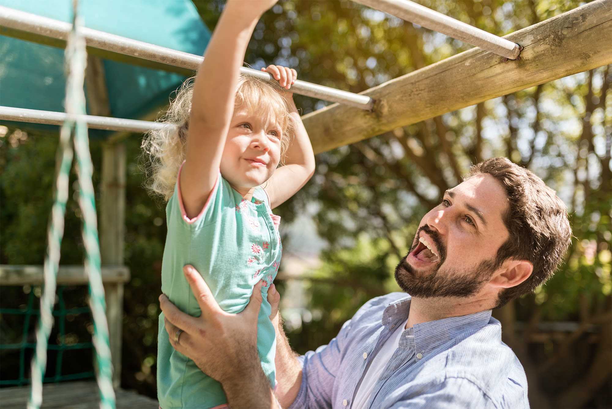 Father and daughter playing at the park at Fox Rest in Laurel, Maryland