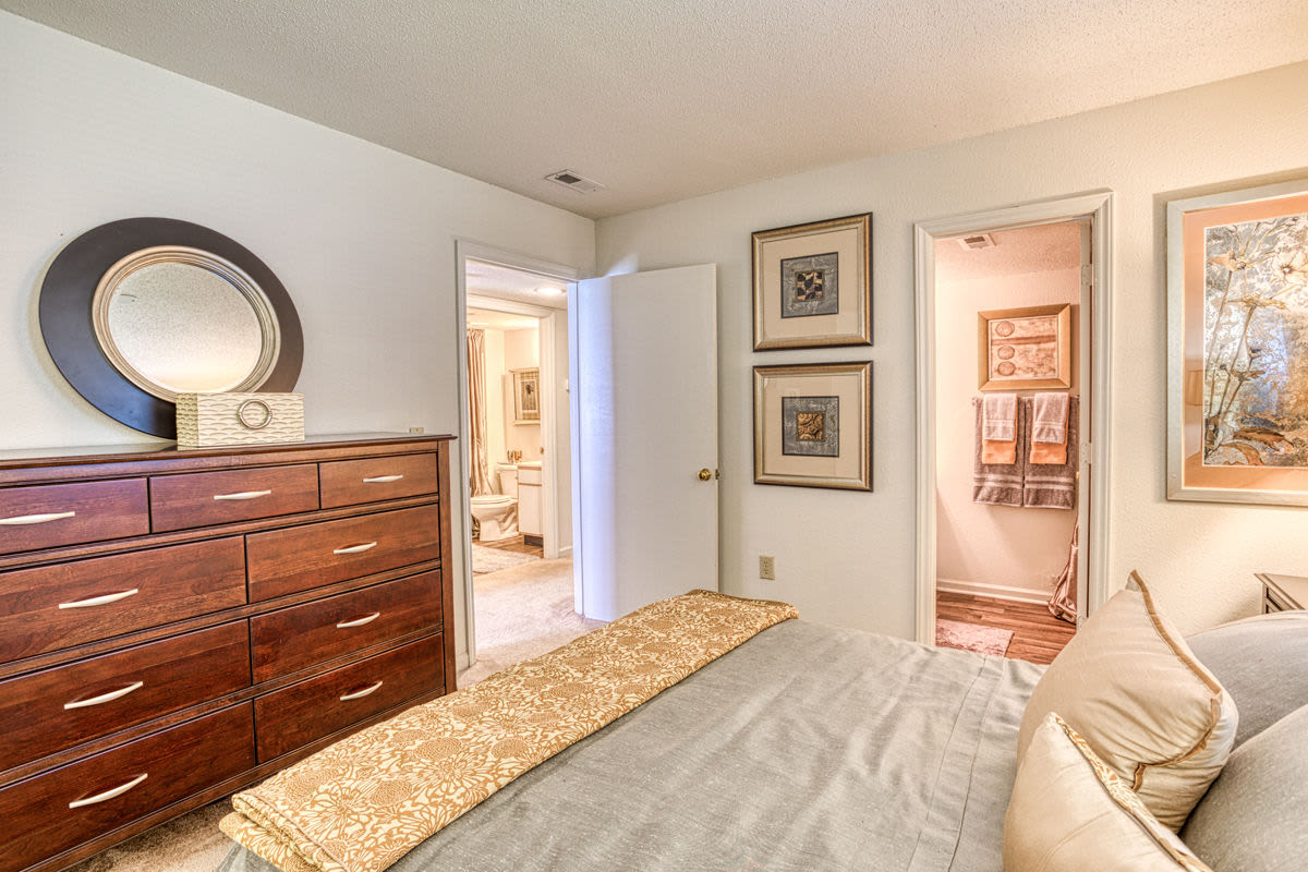 Lovely bedroom with own bathroom with wood-style flooring at Treybrooke Village in Greensboro, North Carolina