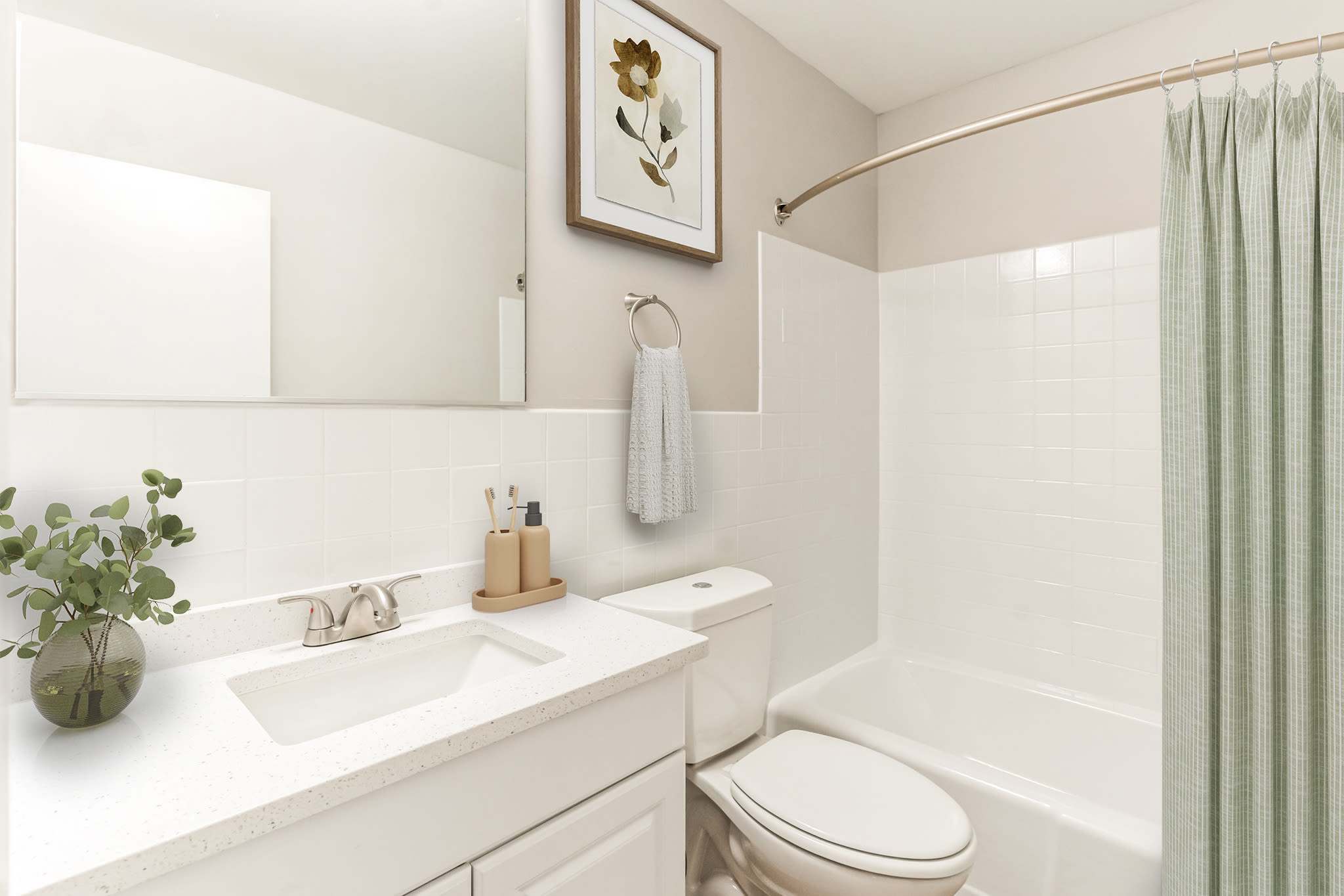 White Bathroom with toilet and bath at Eagle Rock Apartments at Malvern in Malvern, Pennsylvania