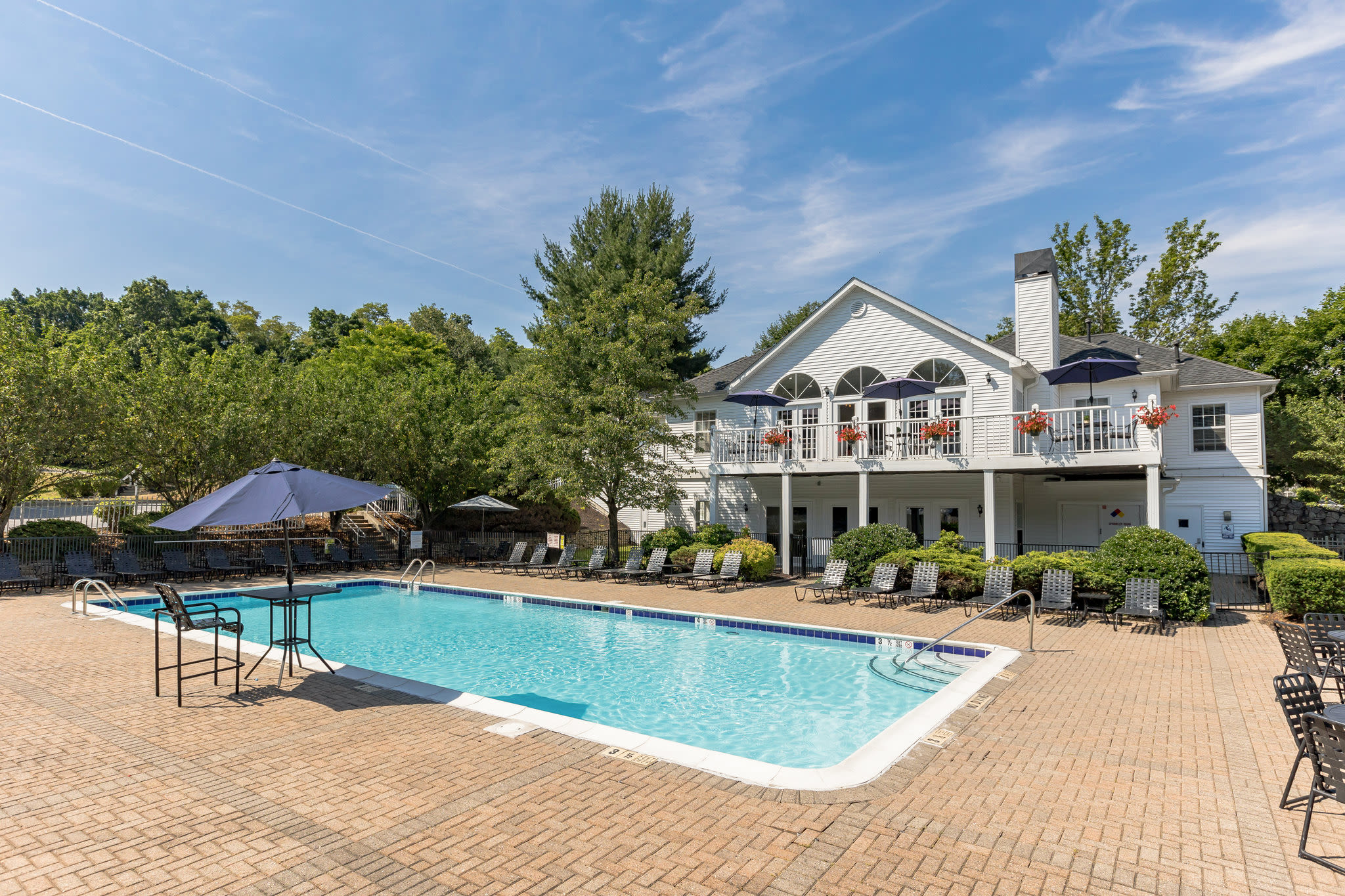 Take a refreshing dip in our swimming pool at Vista Point Apartments' tennis court in Wappingers Falls, New York