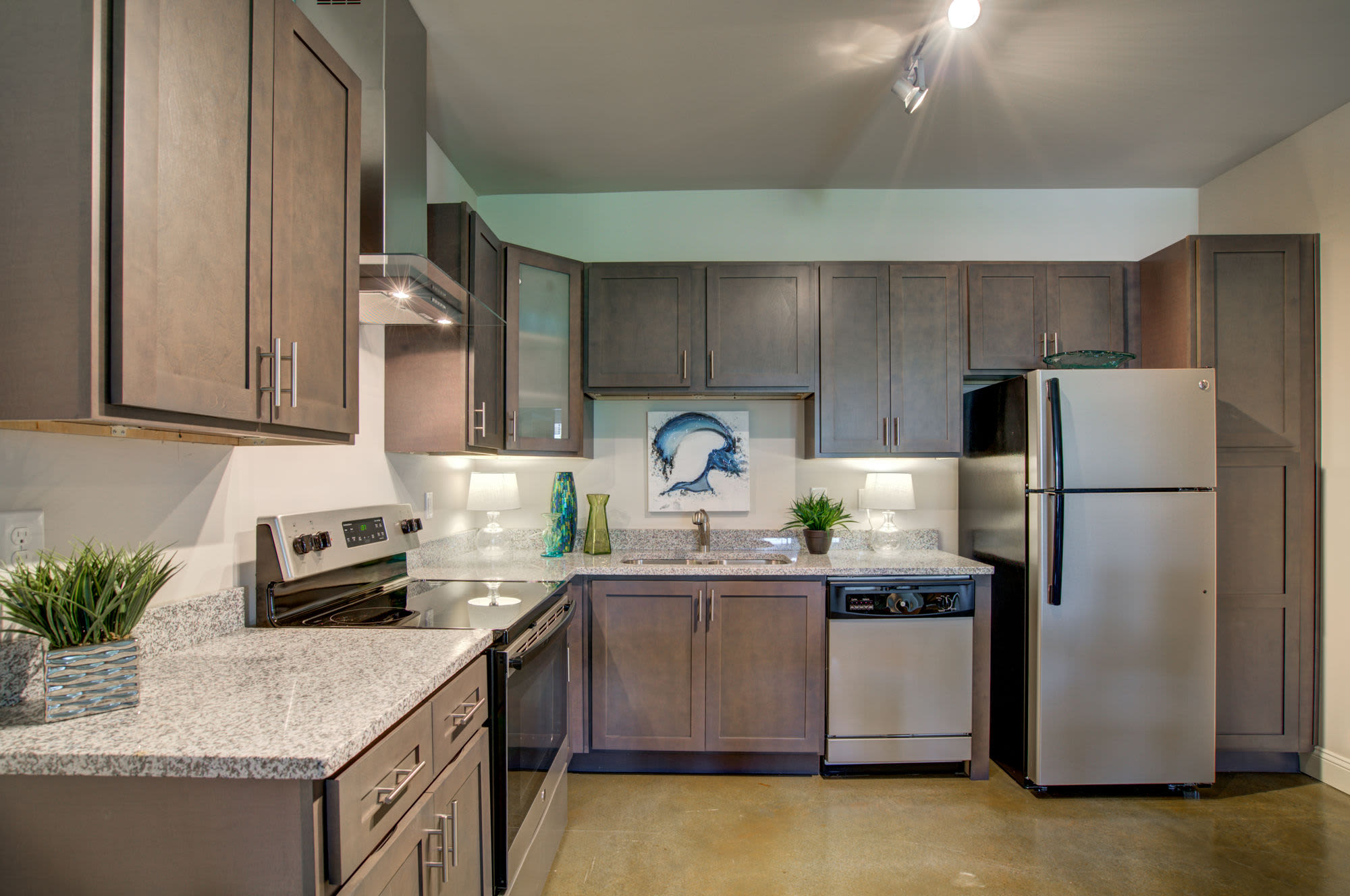 Stainless steel refrigerator and range at Beckstone Apartments in Summerville, South Carolina