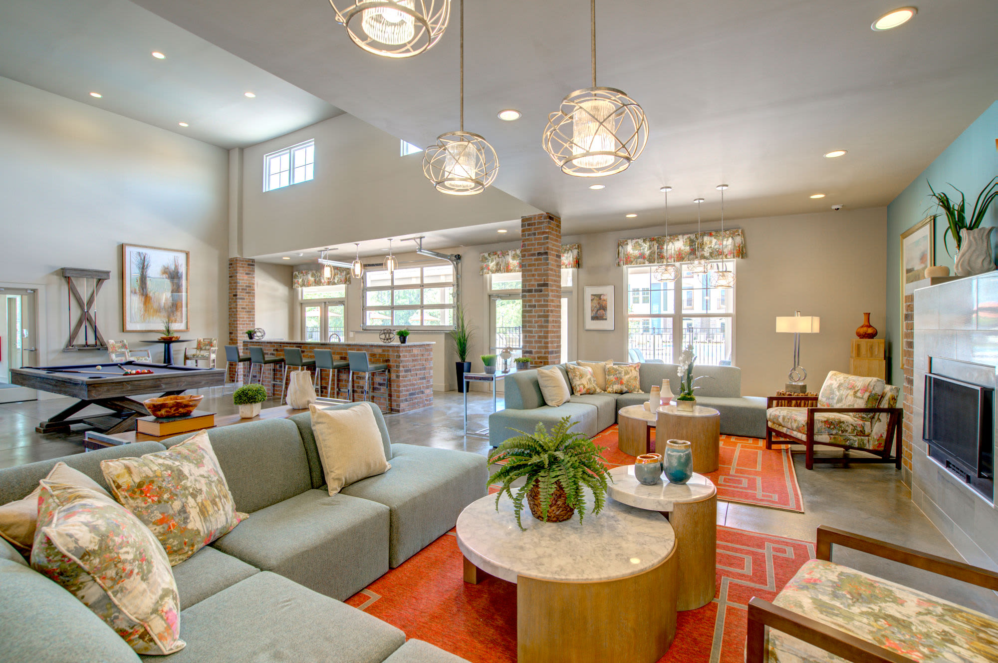 Resident seating area with large couches at entrance of Beckstone Apartments in Summerville, South Carolina
