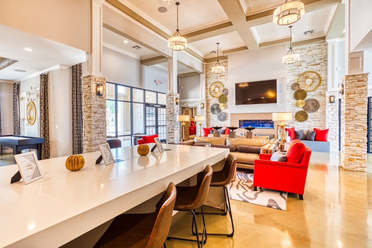 Community lounge with bar area for entertaining at Harborstone in Ladson, South Carolina