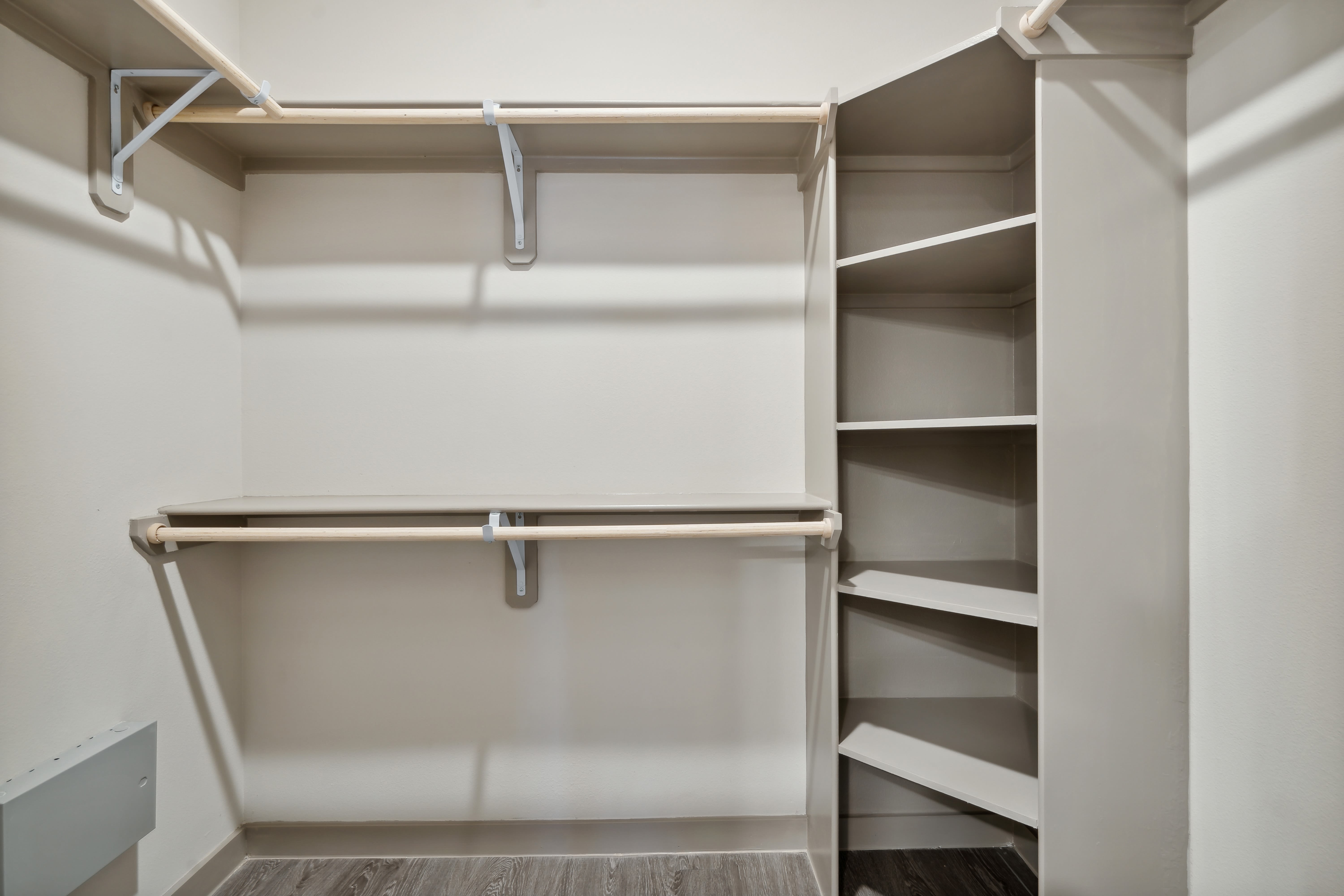 Walk-in closet with built-in shelving at Radius Wolf Ranch in Georgetown, Texas  