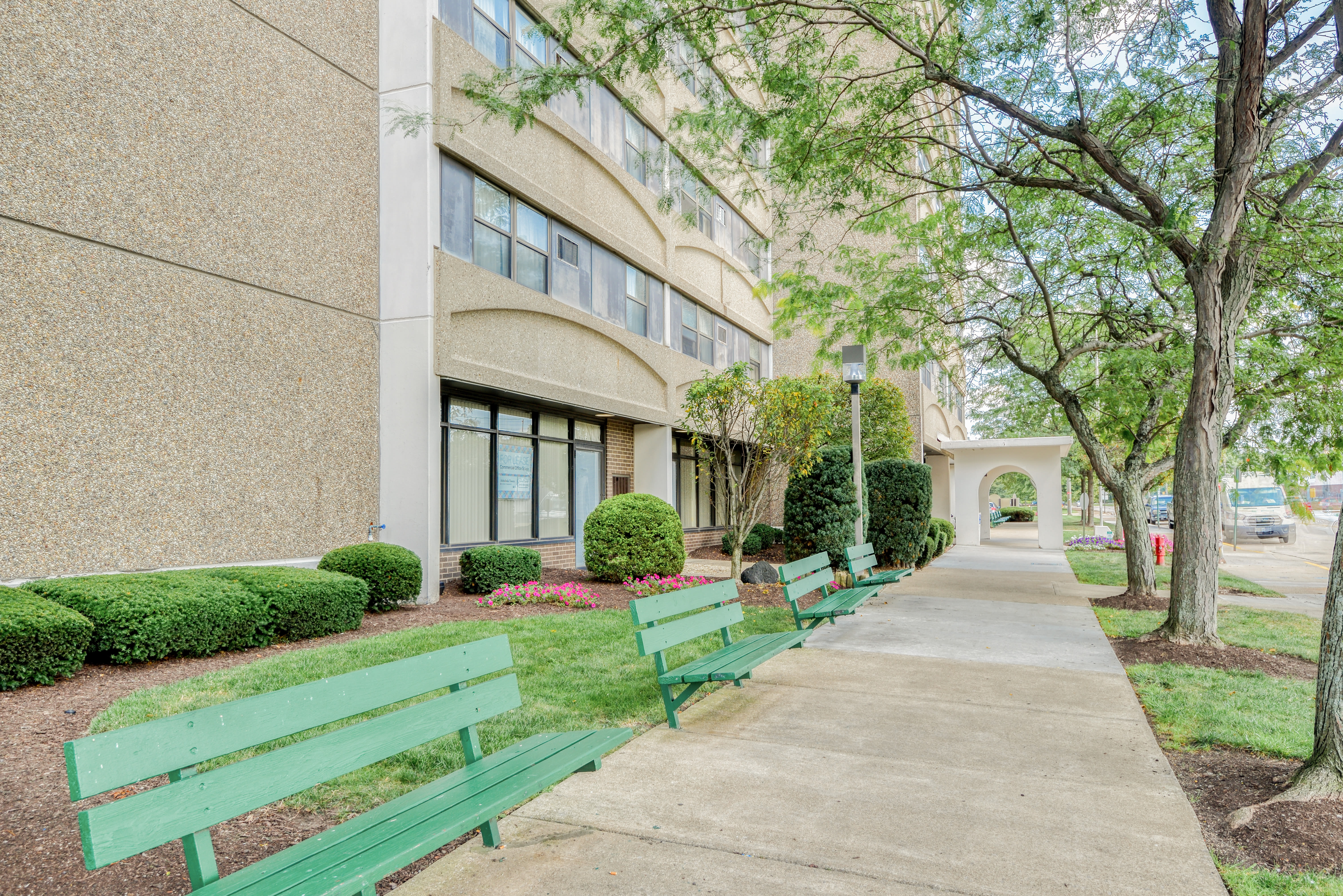 Courtyard and building exterior at Ashtabula Towers in Ashtabula, Ohio