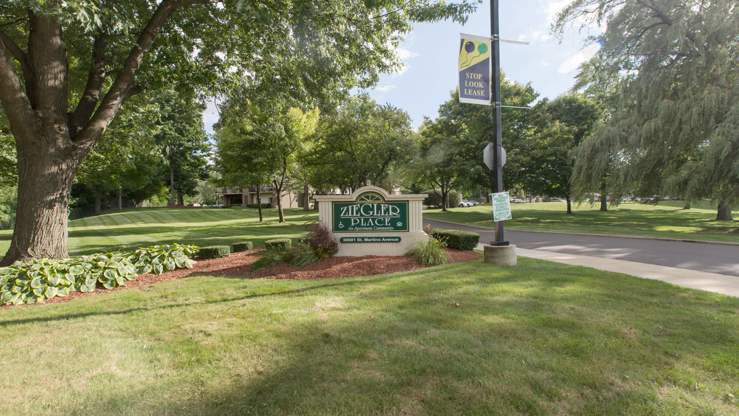 Courtyard and building exterior at Ziegler Place in Livonia, Michigan