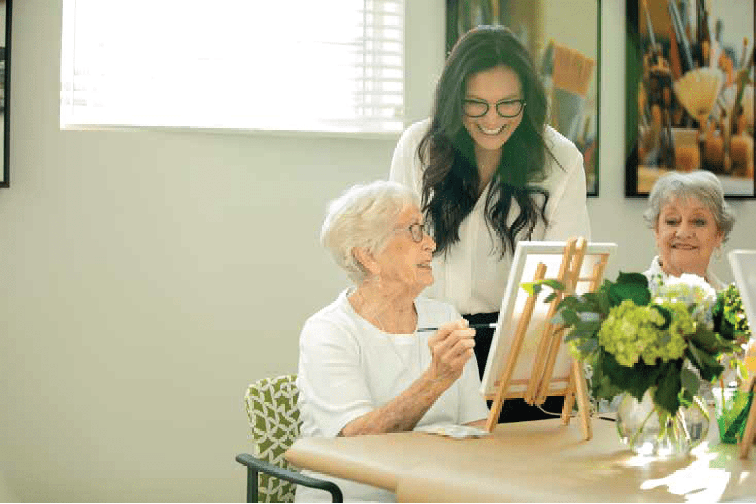 residents participating in a painting class at Clearwater at The Heights in Houston, Texas