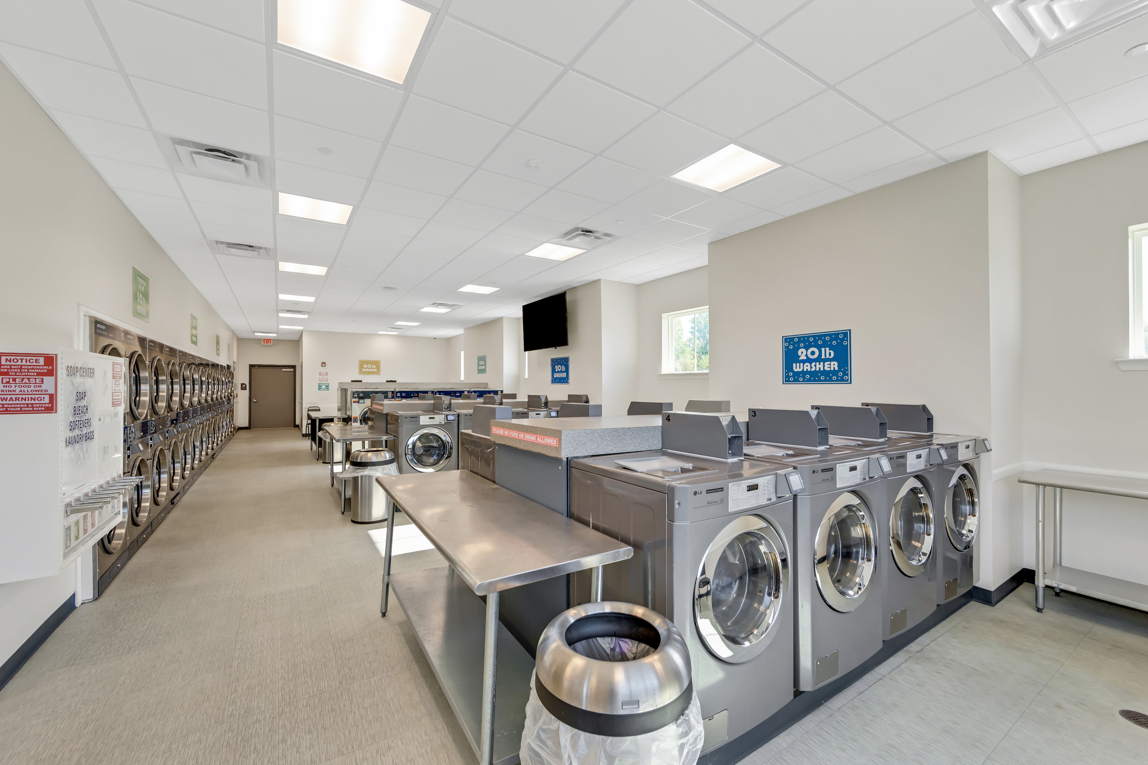 A spacious laundry room with multiple washing machines at Blair Mill Village East Apartment Homes, Horsham, Pennsylvania