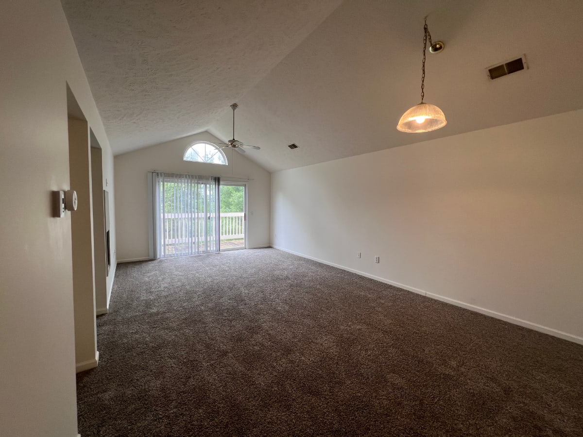 Modern furnishings in a model home's living space at The Abbey in Ionia, Michigan