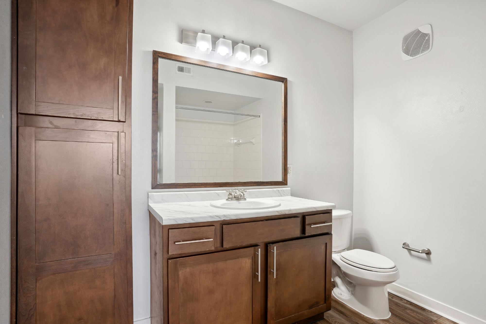 white bathroom at Flatiron District at Austin Ranch in The Colony, Texas