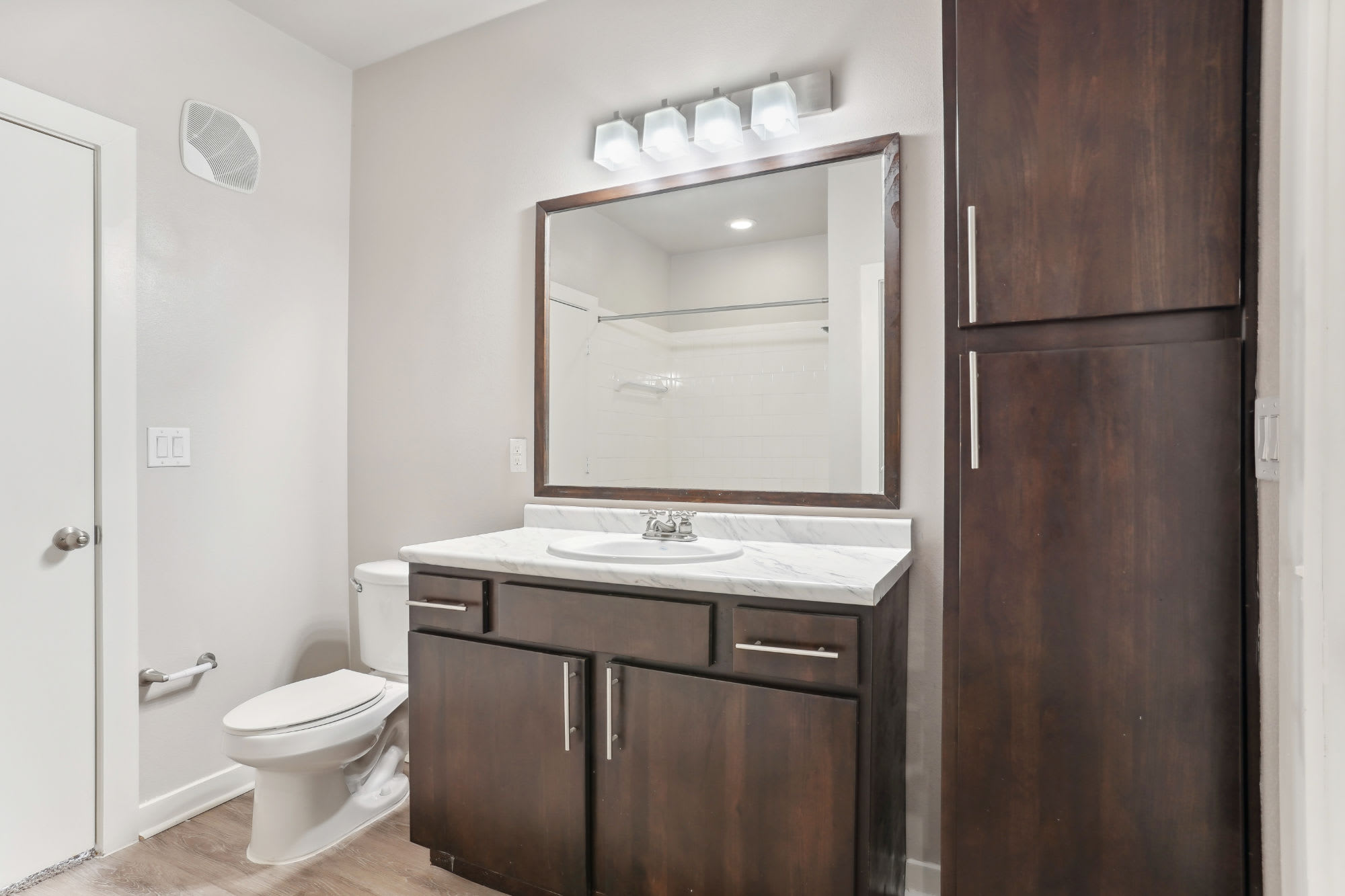 white bathroom at Flatiron District at Austin Ranch in The Colony, Texas