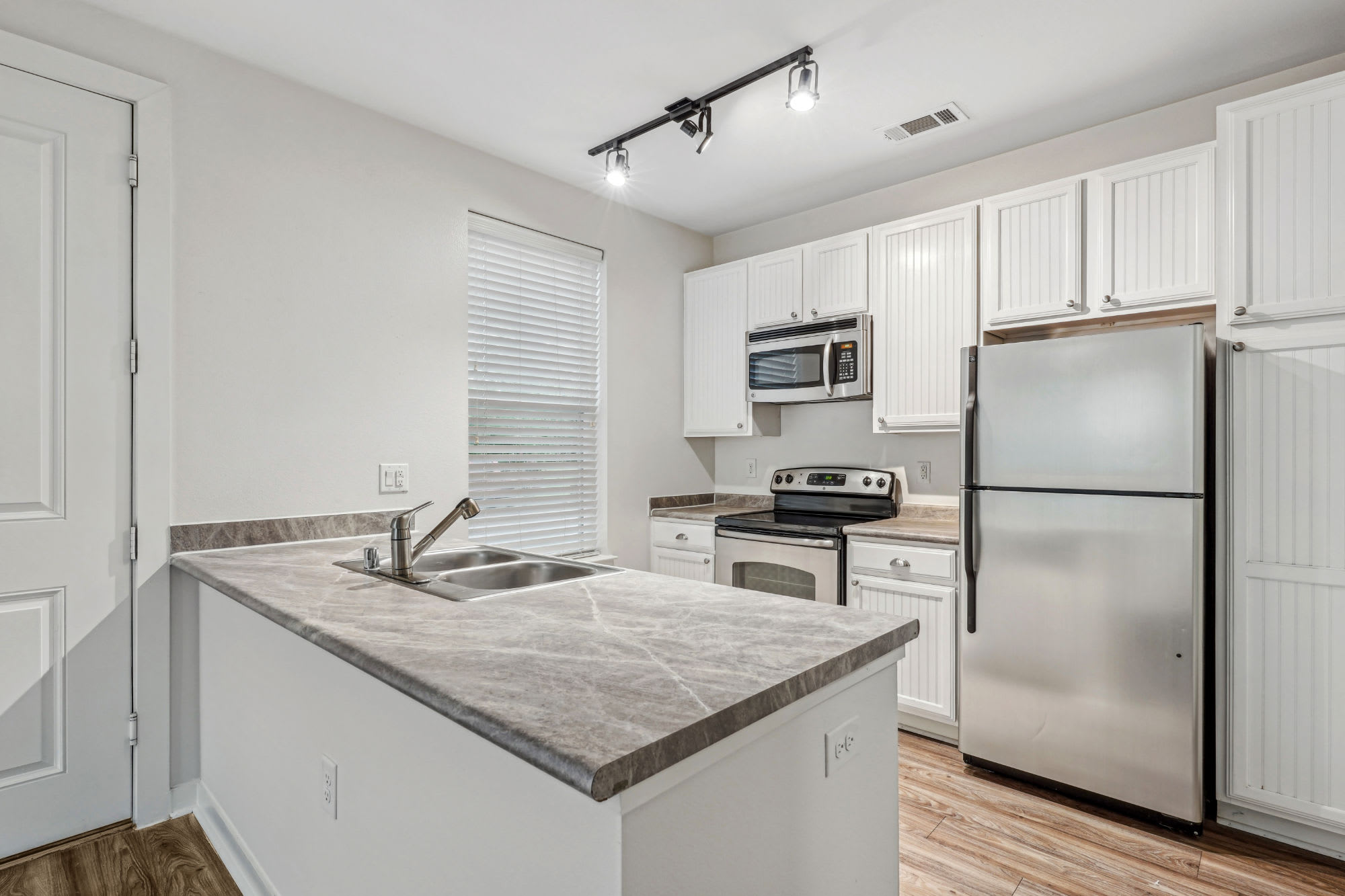 white kitchen at Flatiron District at Austin Ranch in The Colony, Texas