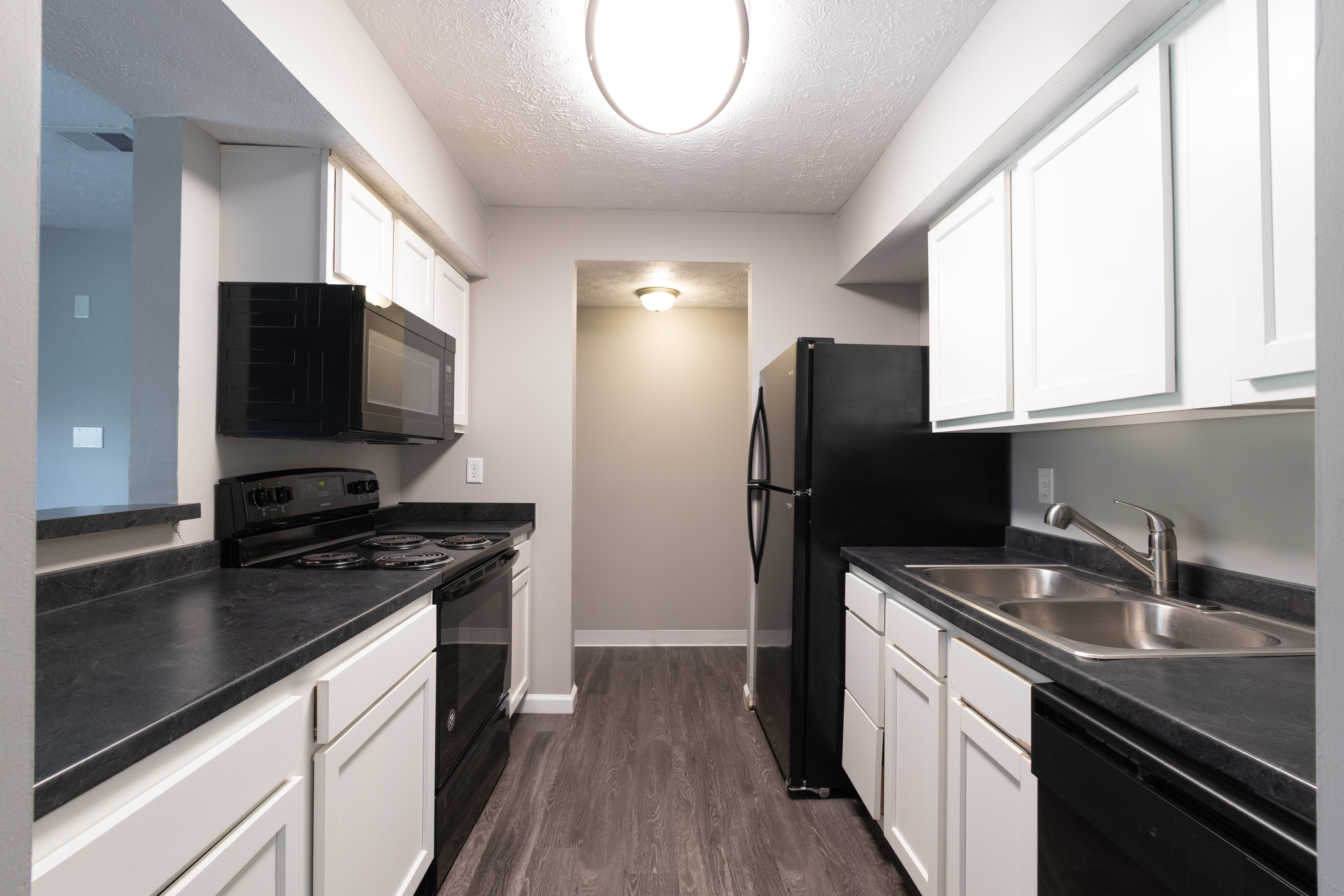 A well-equipped kitchen with wooden floor at Crosswinds in Indianapolis, Indiana