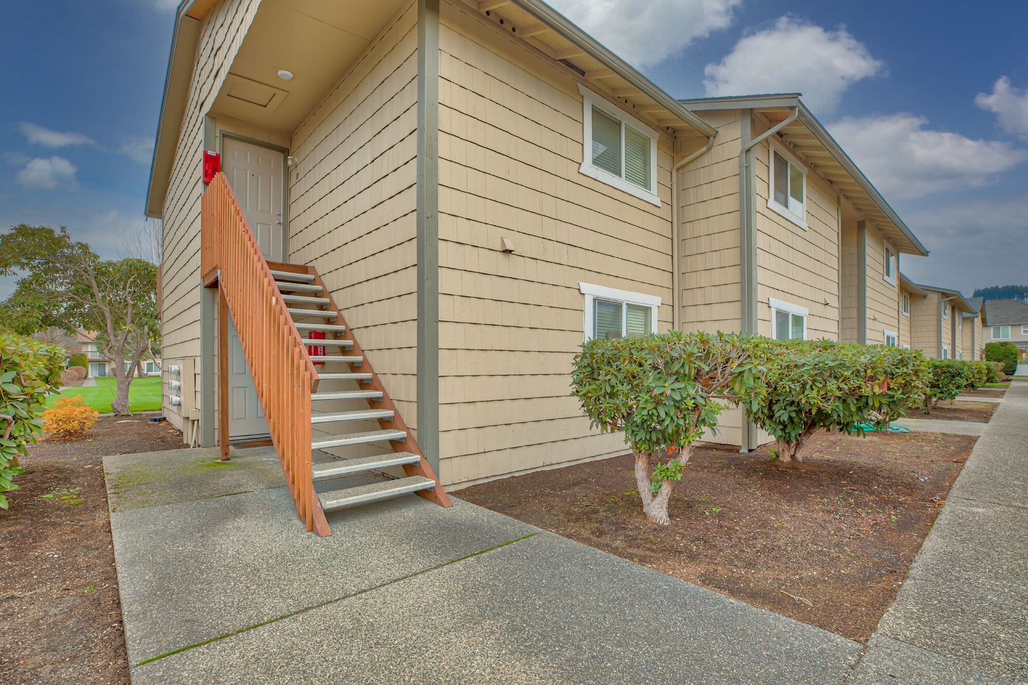 Stairs leading to a apartment building at Elm Valley Apartments in Sumner, Washington