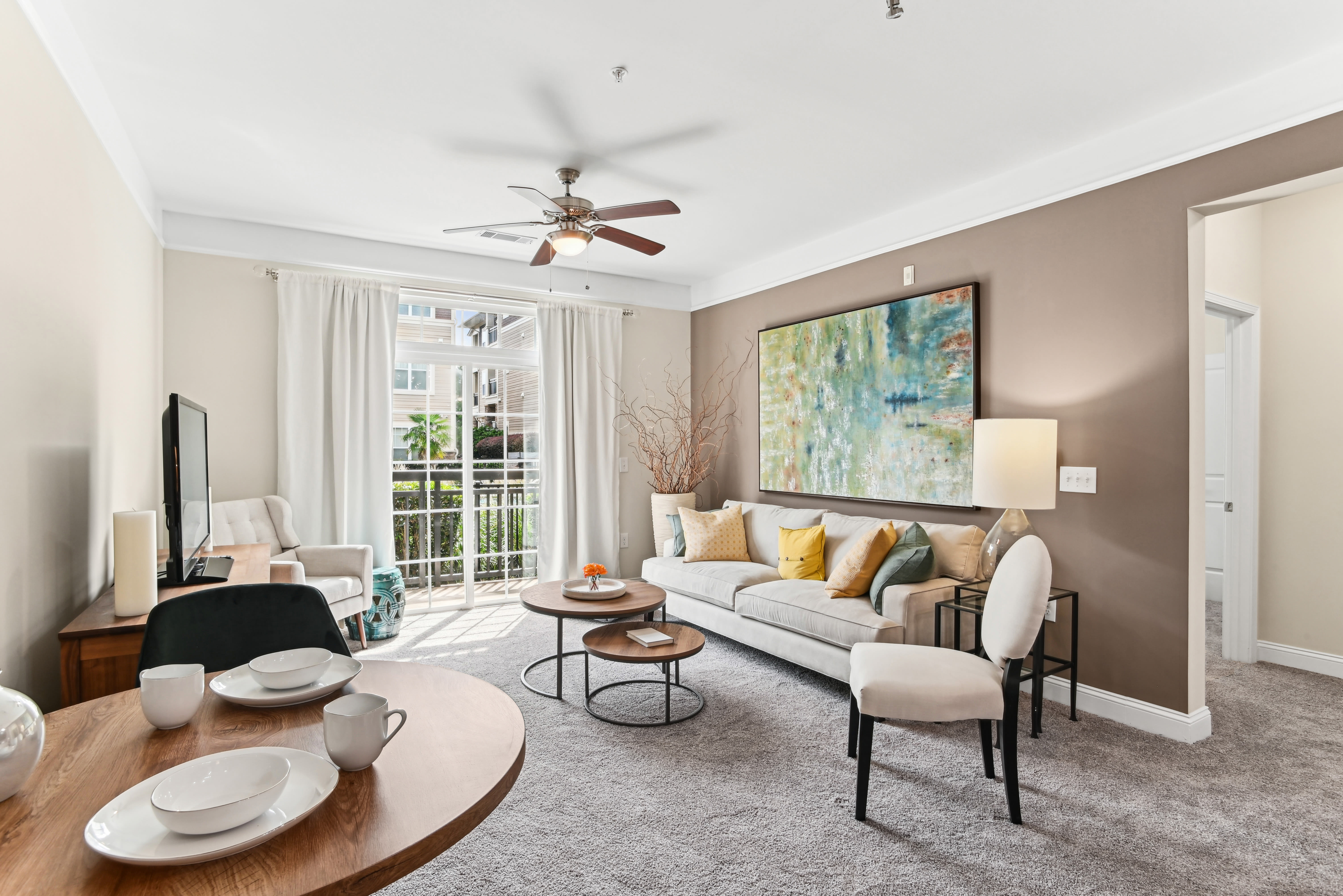 Feel at home at our cozy living rooms at Fountains at Mooresville Town Square in Mooresville, North Carolina