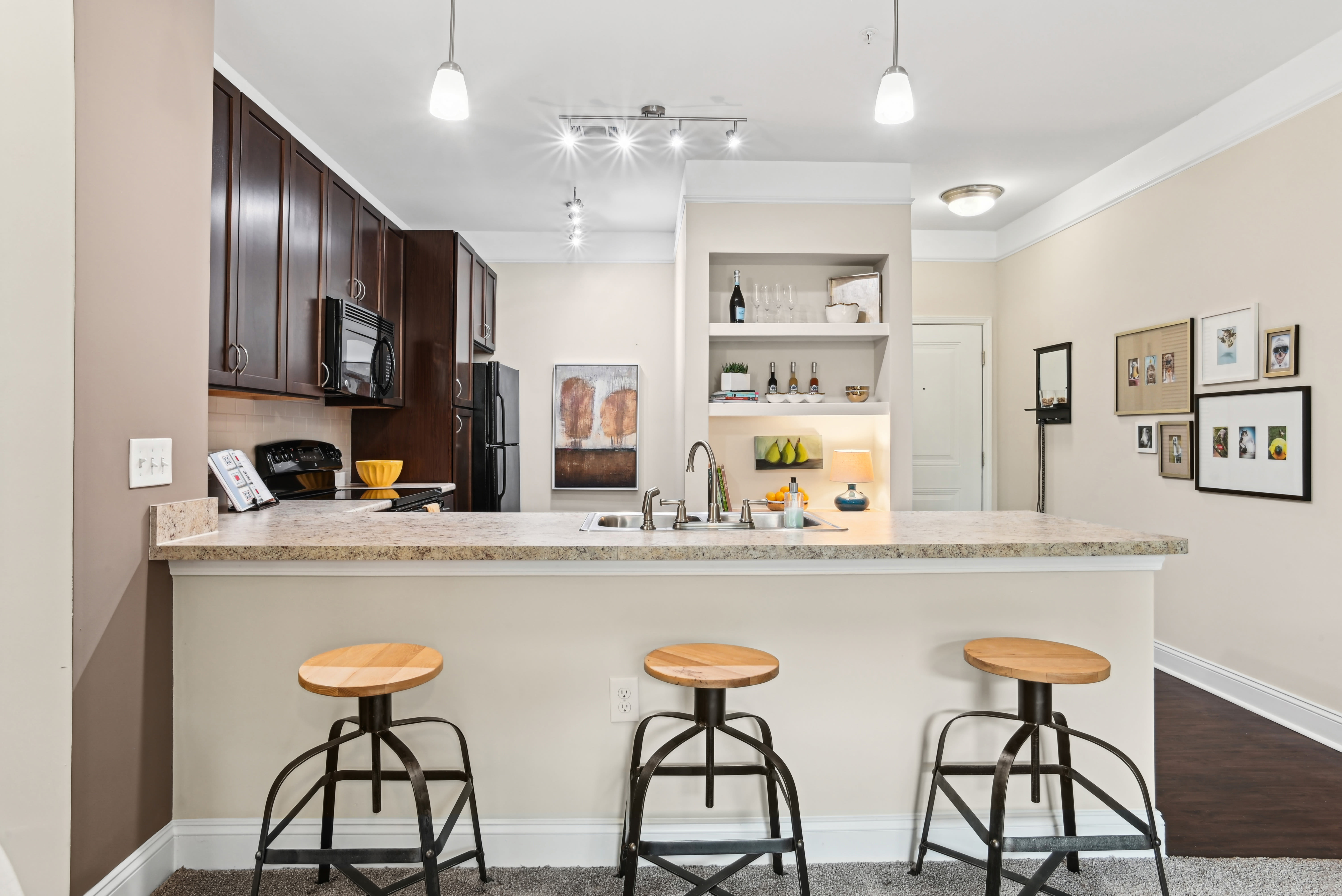 Apartments with an island Cozy living in apartments at Fountains at Mooresville Town Square in Mooresville, North Carolina