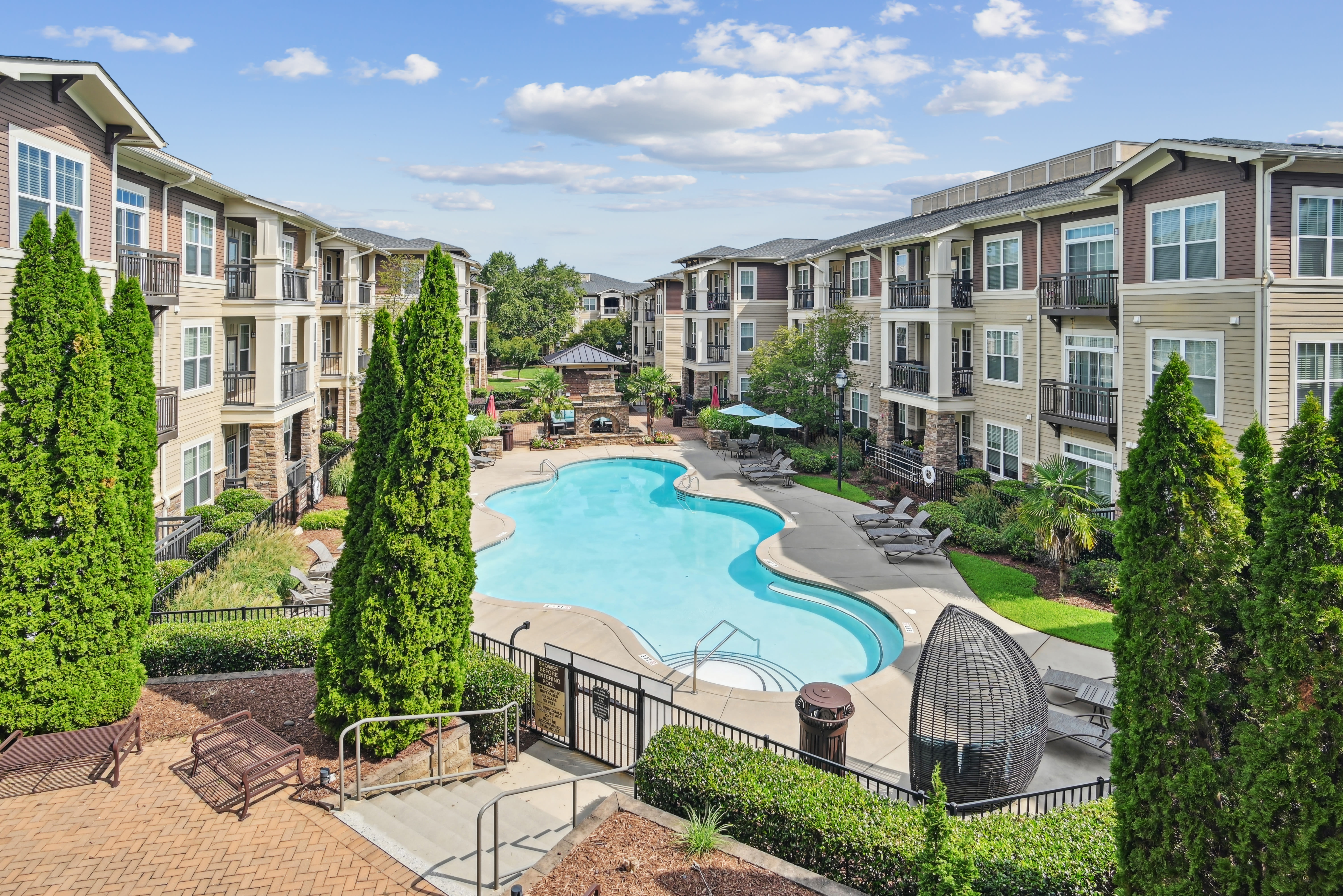 Apartments with a swimming pool at Fountains at Mooresville Town Square in Mooresville, North Carolina