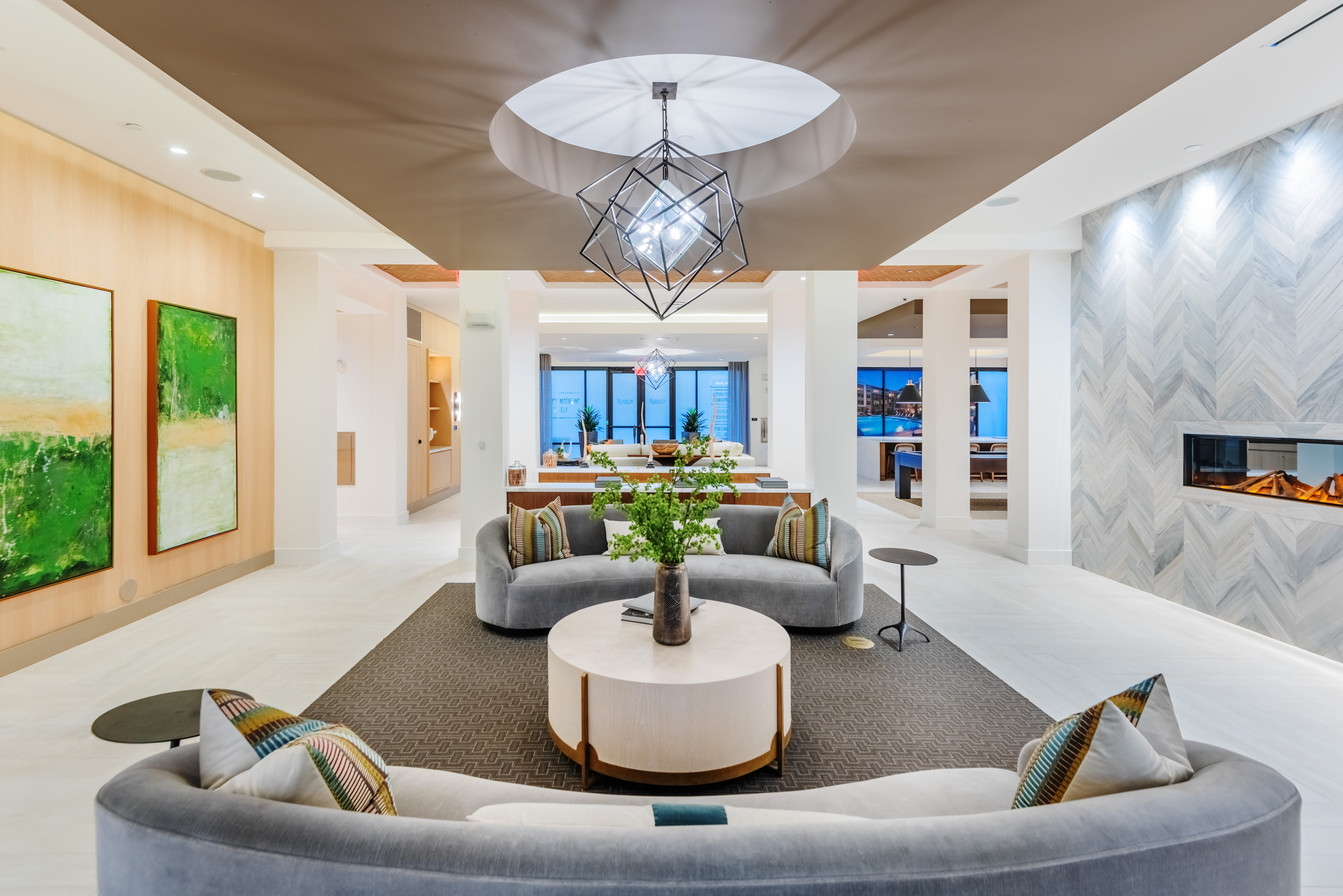 Community lounge area with tables and lots of seating at The Reverie At Lake Boone in Raleigh, North Carolina