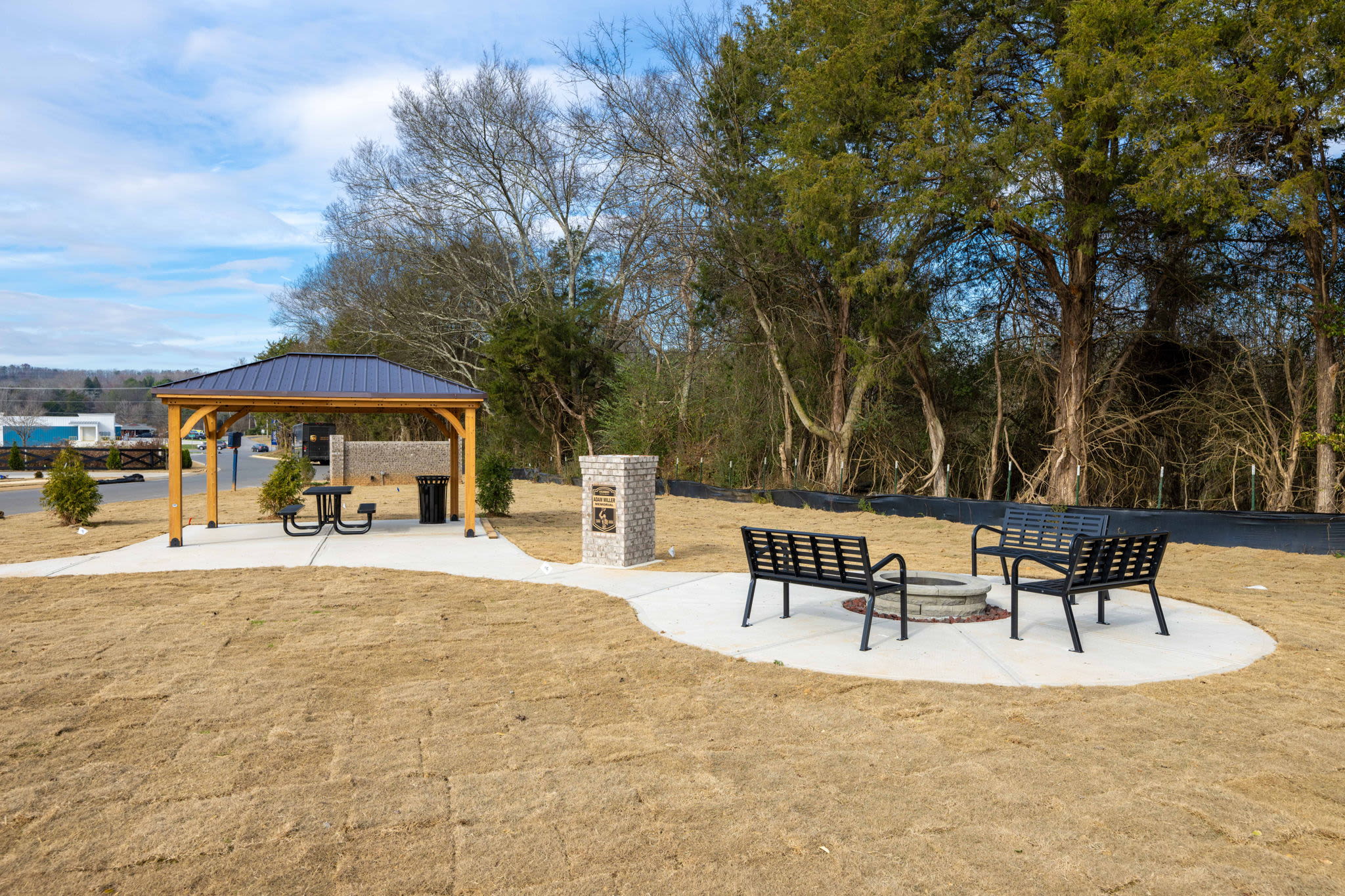 Stylish pergola seating area and cozy fire pit lounge at Miller Landing in Cleveland, Tennessee