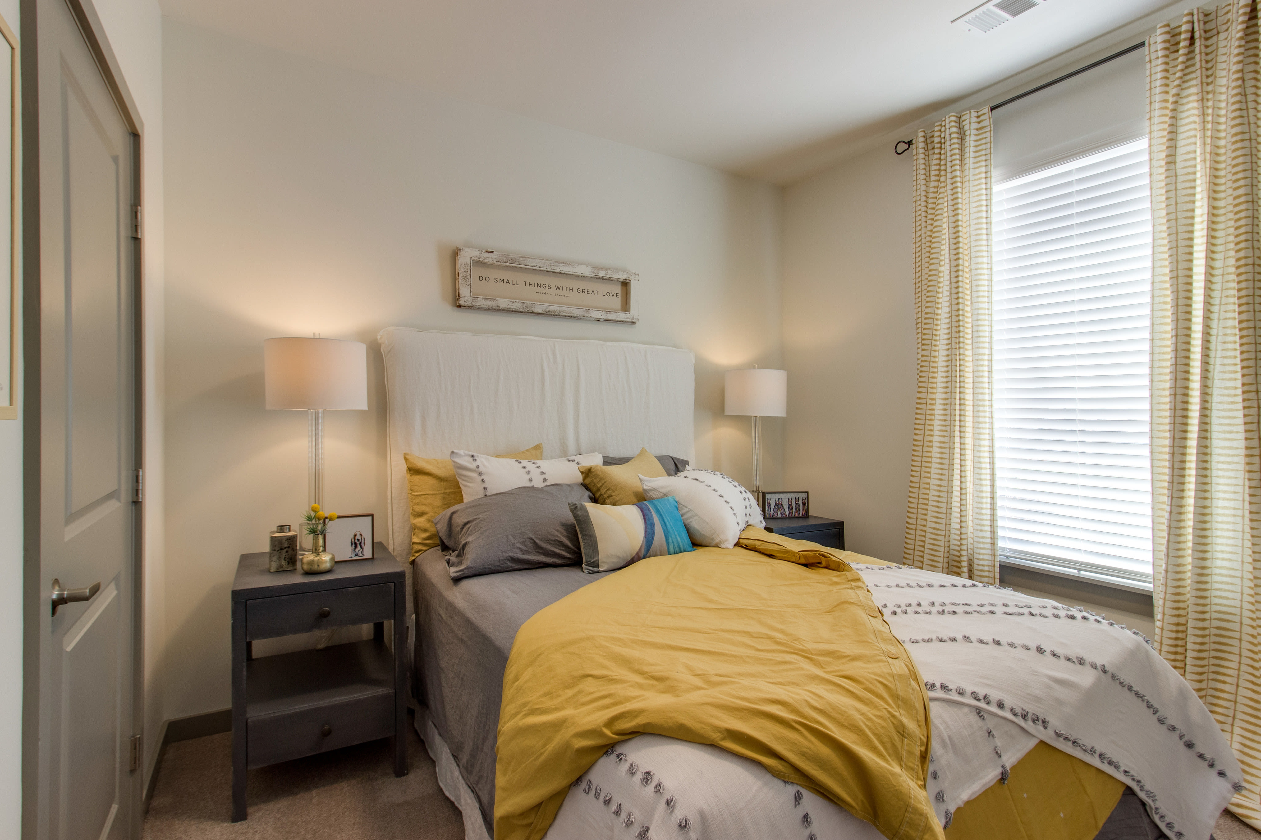 Bedroom with large window and nightstand at The Banks at West Fork in Murfreesboro, Tennessee