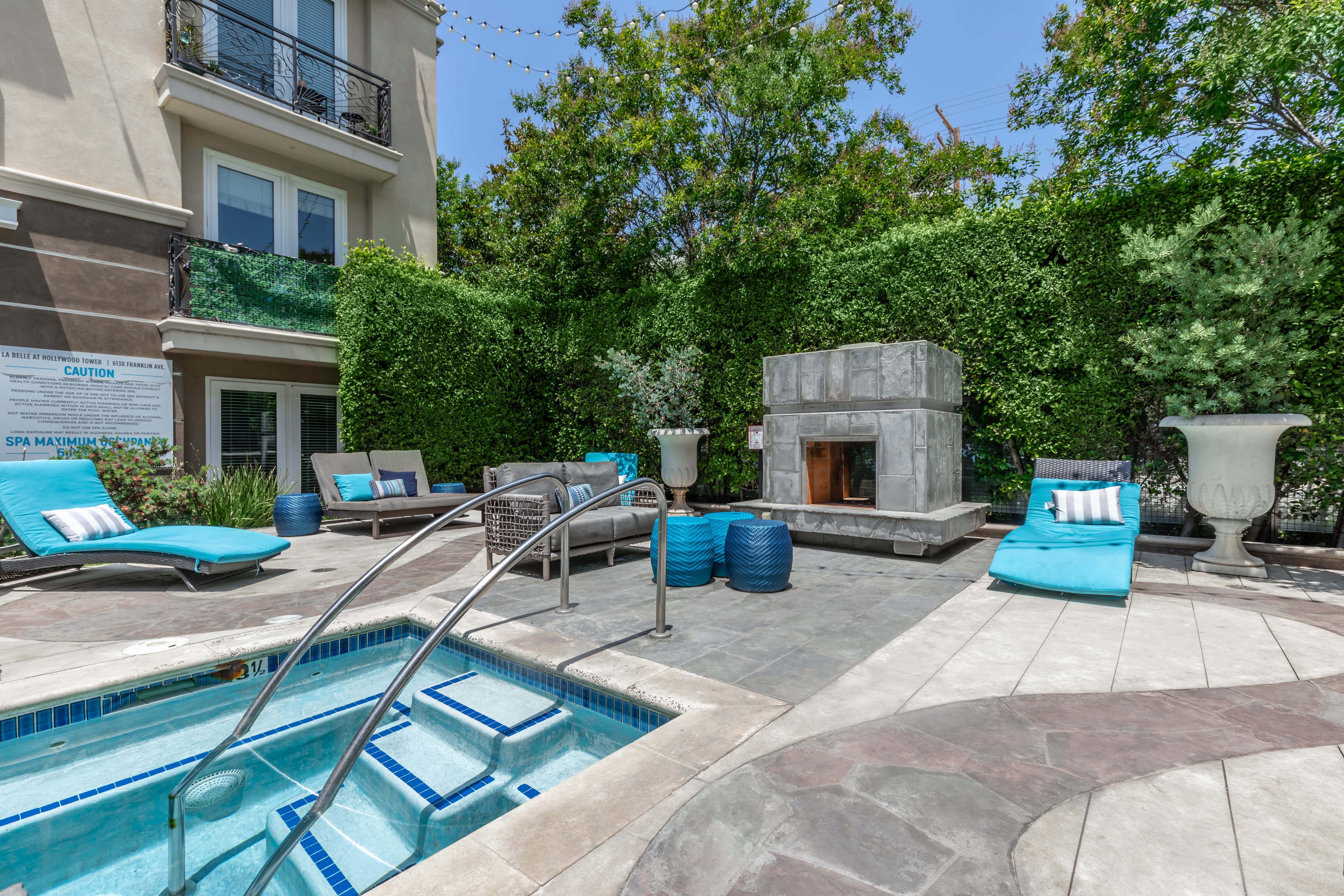 Hot tub with a lounge area for residents to relax at La Belle at Hollywood Tower in Los Angeles, California