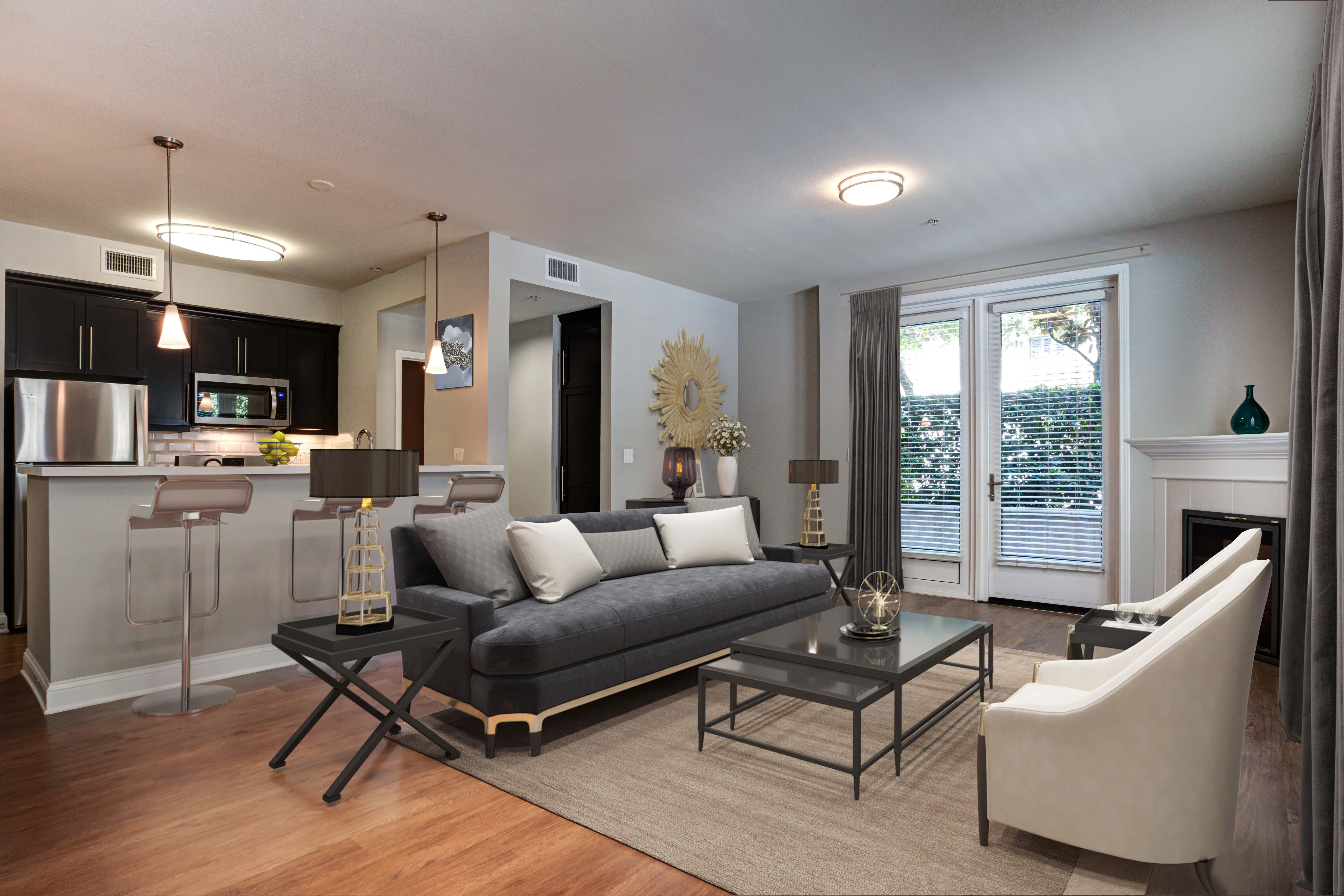 Well-furnished apartment living room with plank wood-flooring at La Belle at Hollywood Tower in Los Angeles, California