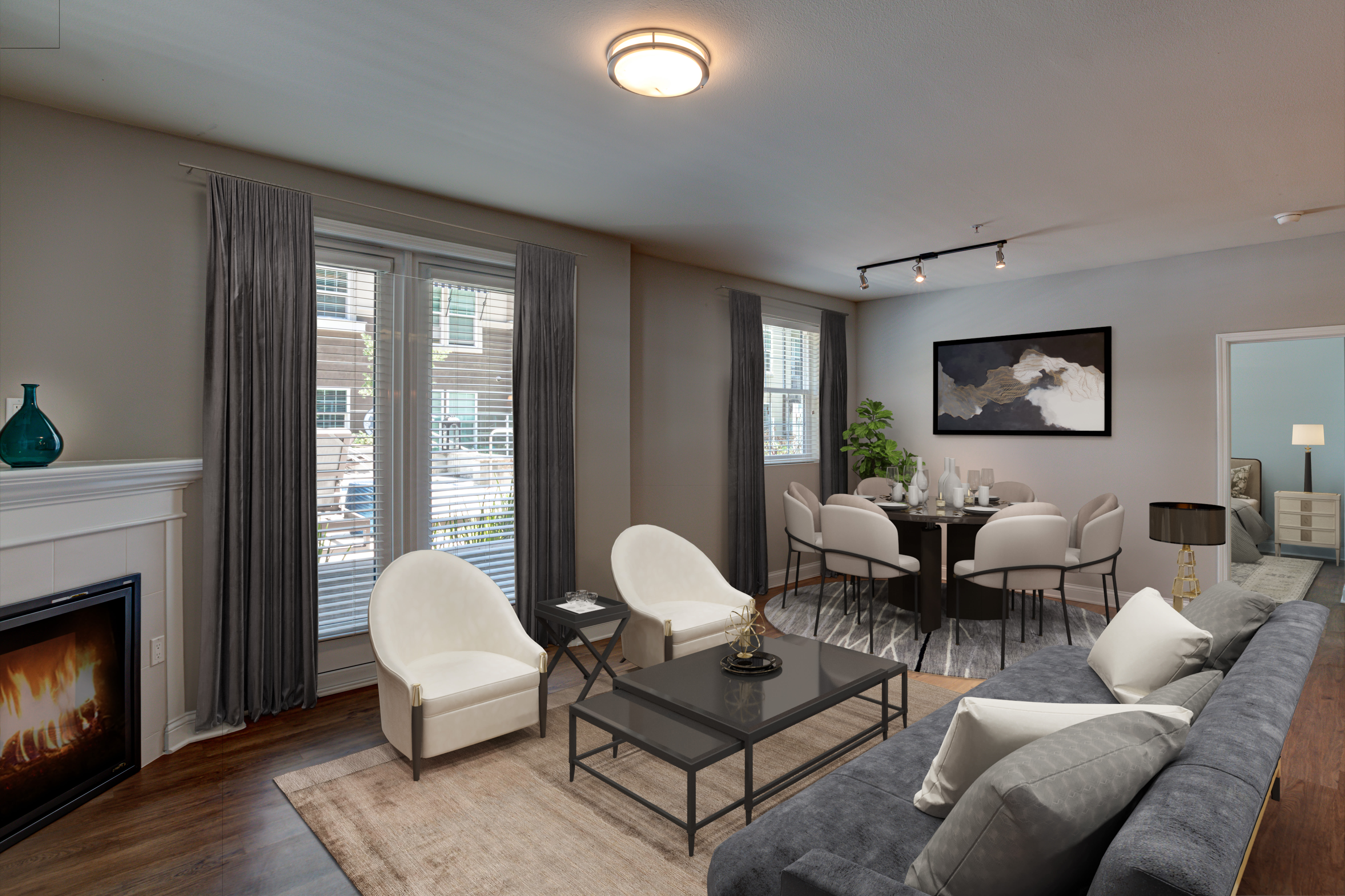 Apartment living room with a dining space beside it at La Belle at Hollywood Tower in Los Angeles, California
