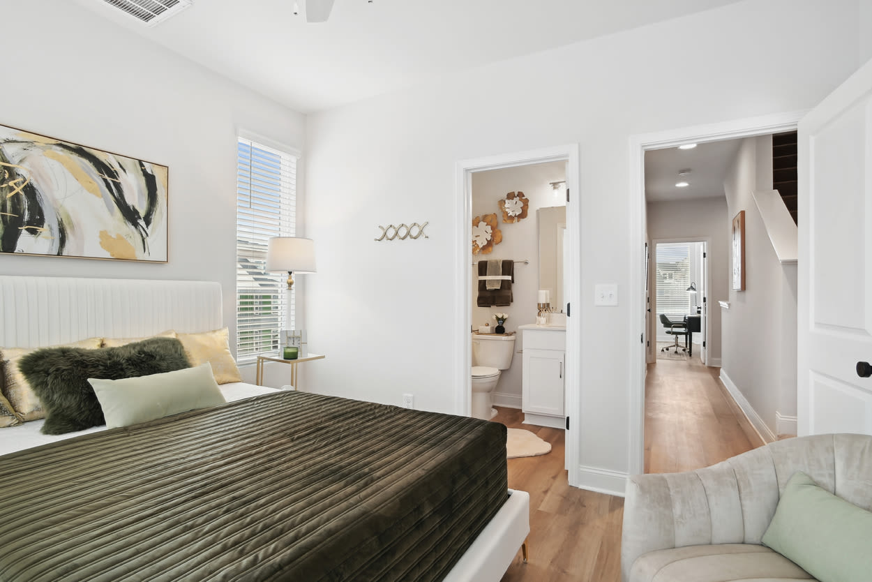 Bedroom with attached bathroom at Towns At Eastland in Charlotte, North Carolina