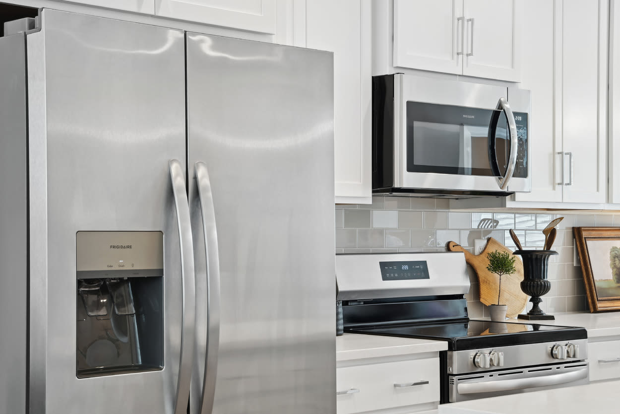 Kitchen with refrigerator and oven at Towns At Eastland in Charlotte, North Carolina