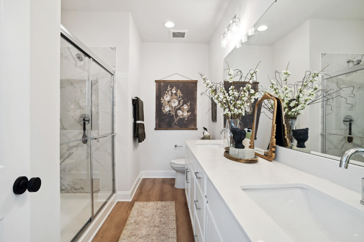 Bathroom with bathtub and commode at Towns At Eastland in Charlotte, North Carolina